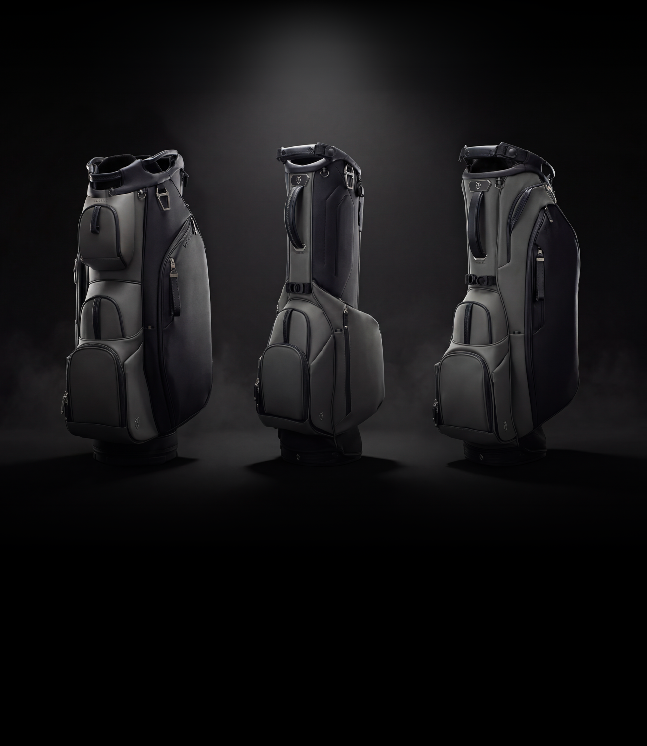 Three golf bags in the phantom colorway on a dark background