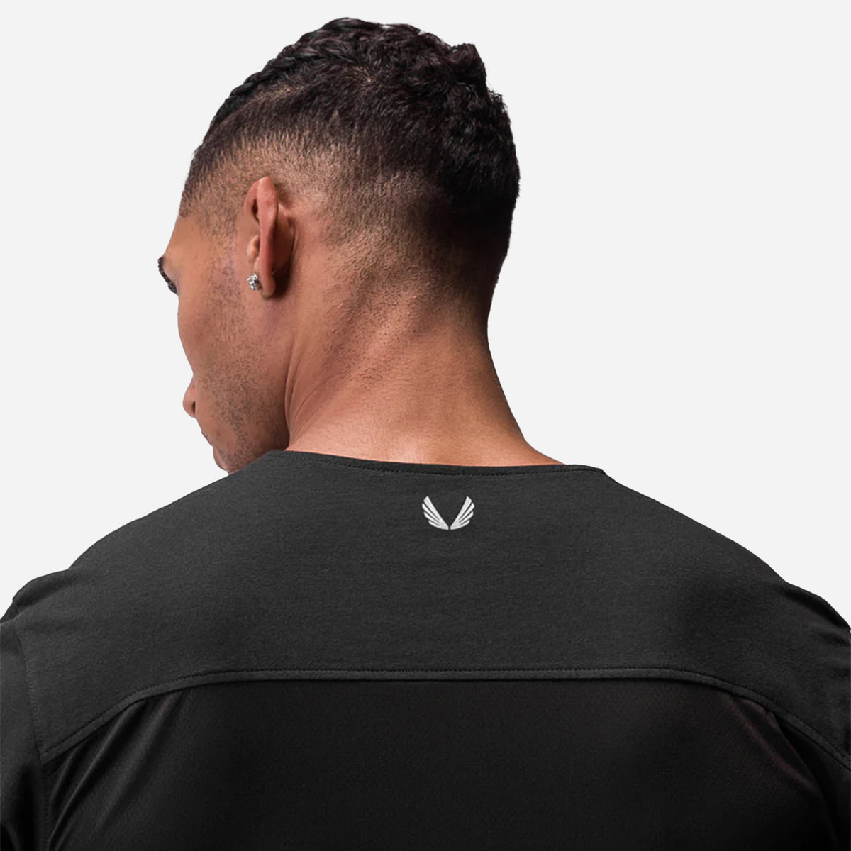 Man facing backwards wearing Black VESSEL x ASRV CottonPlus Standard Mesh Back Tee #color_black