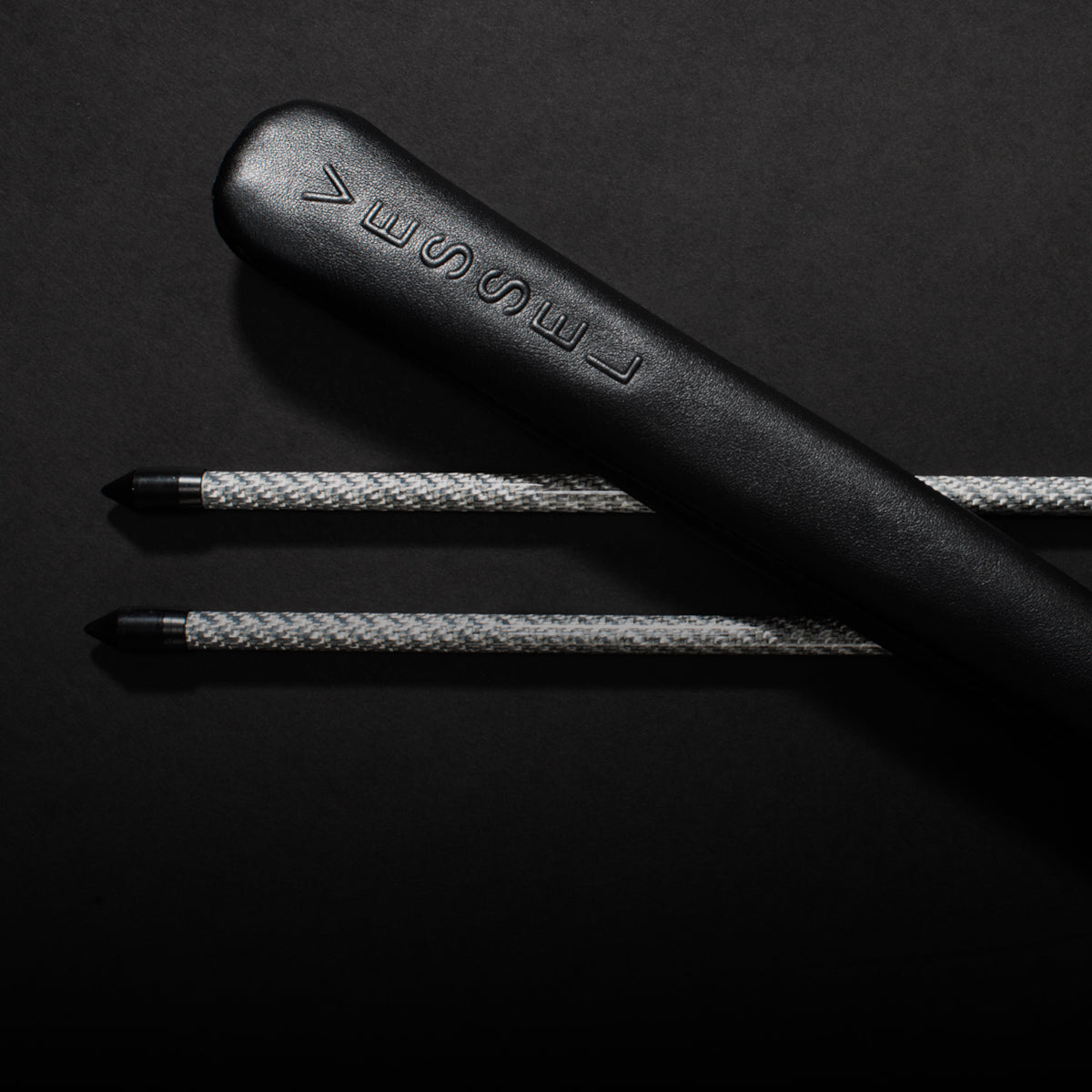 Alignment stick set with leather cover laid across them