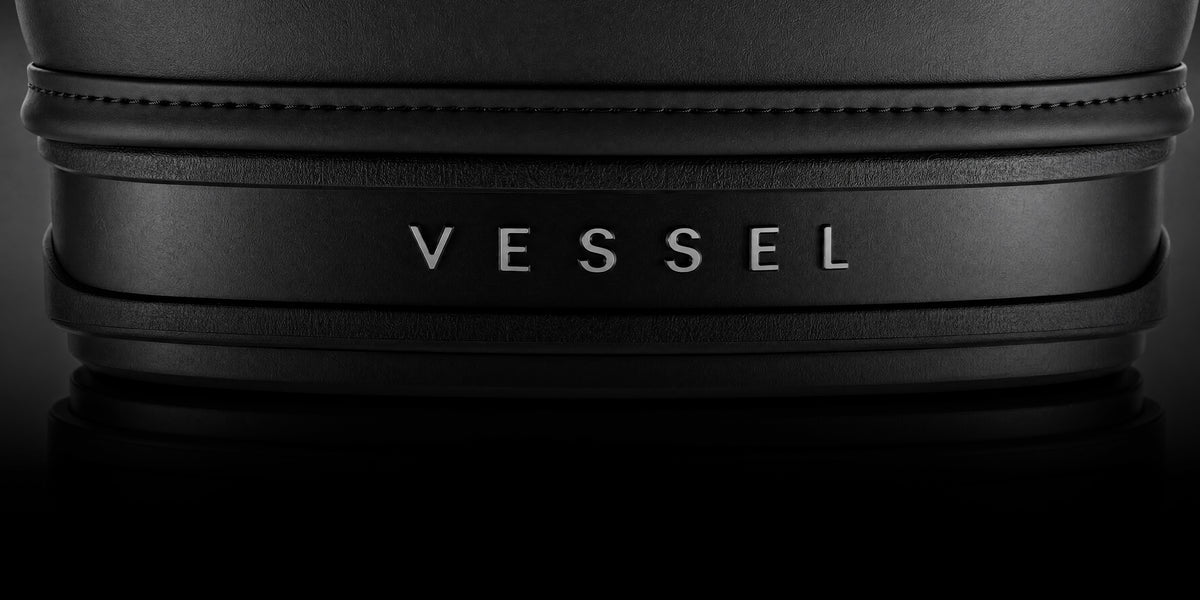 Close up image of the dark VESSEL emblem on bottom of golf bag