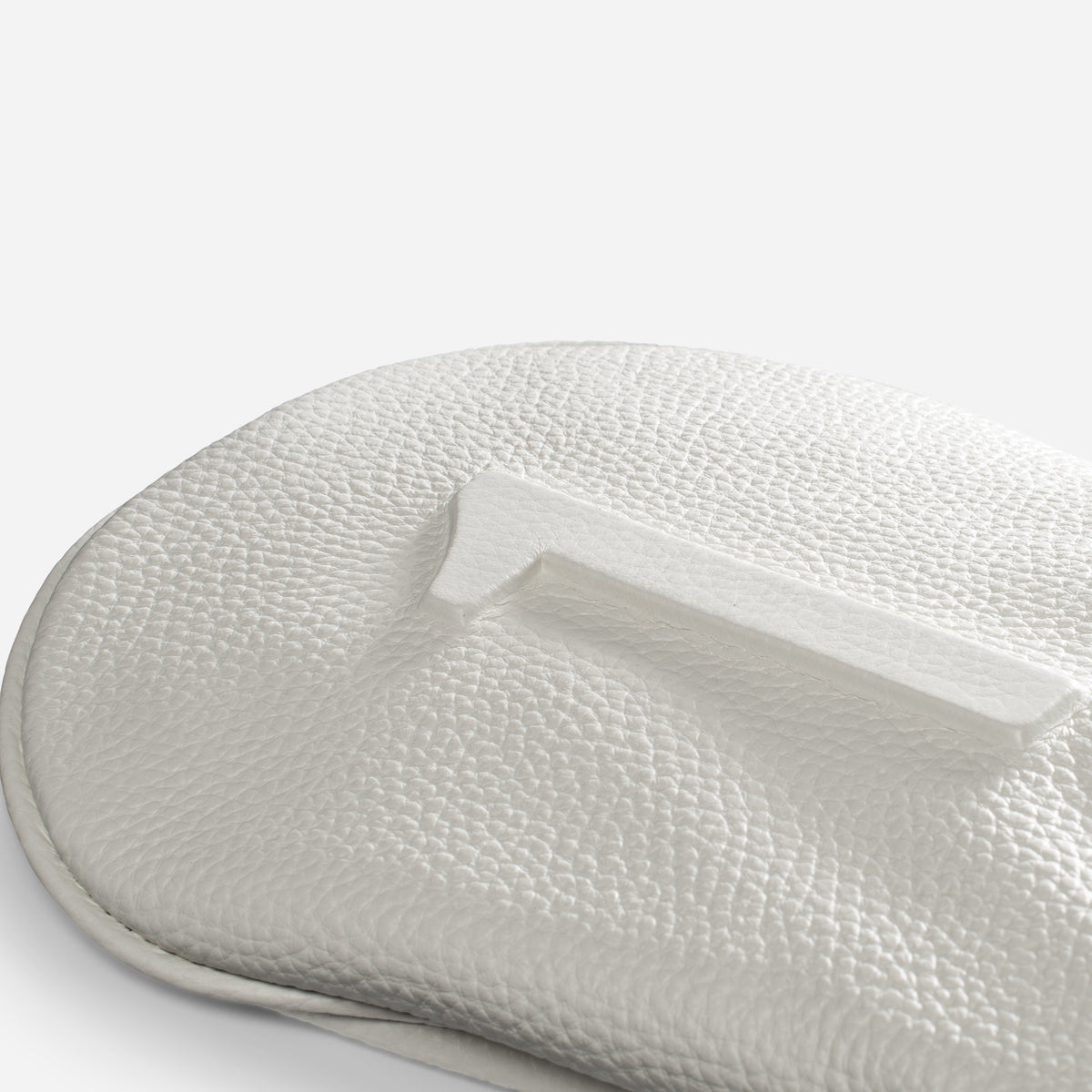 close up of embossed number on White pebbled leather headcover - driver #size_driver