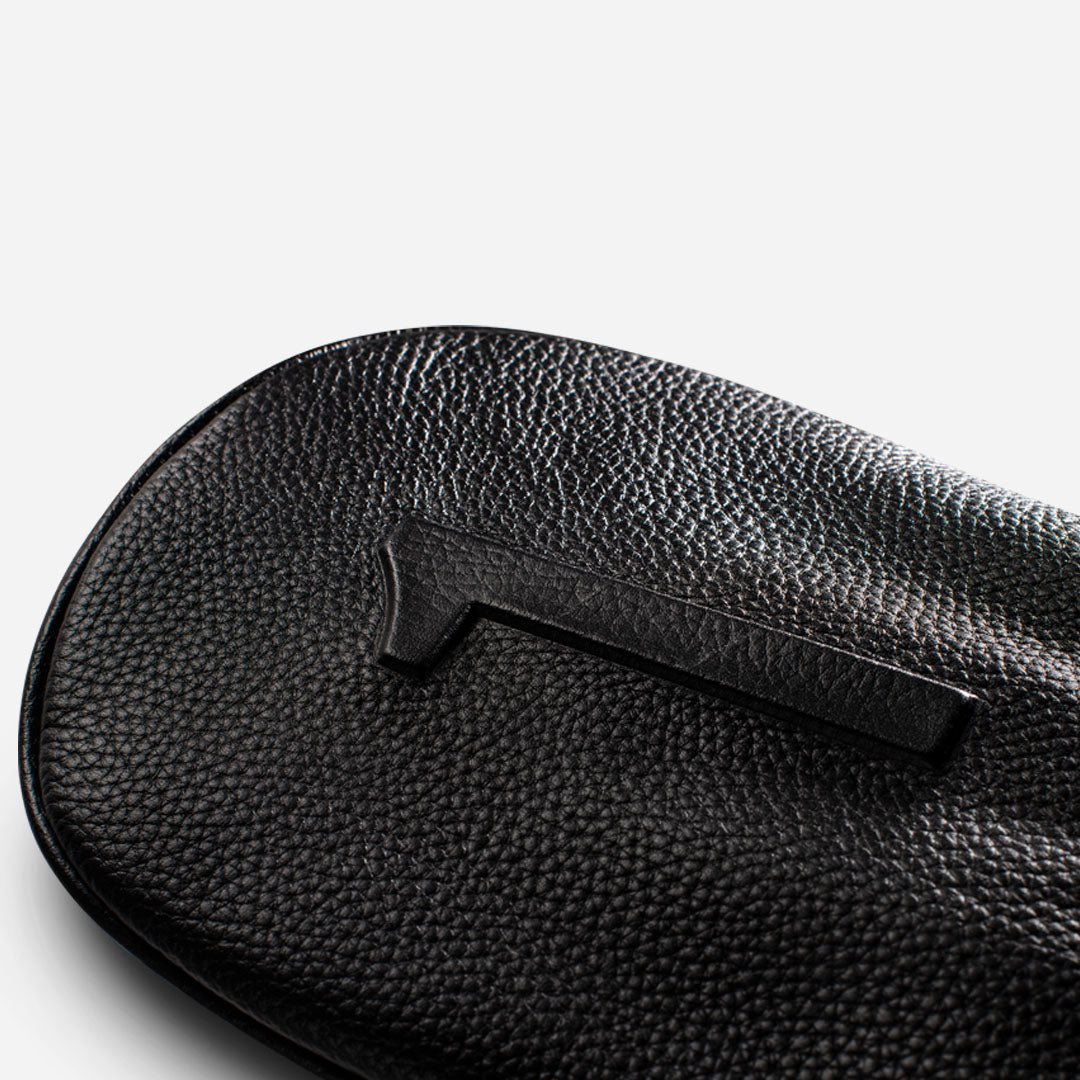 close up of embossed number on Black pebbled leather headcover - driver #size_driver
