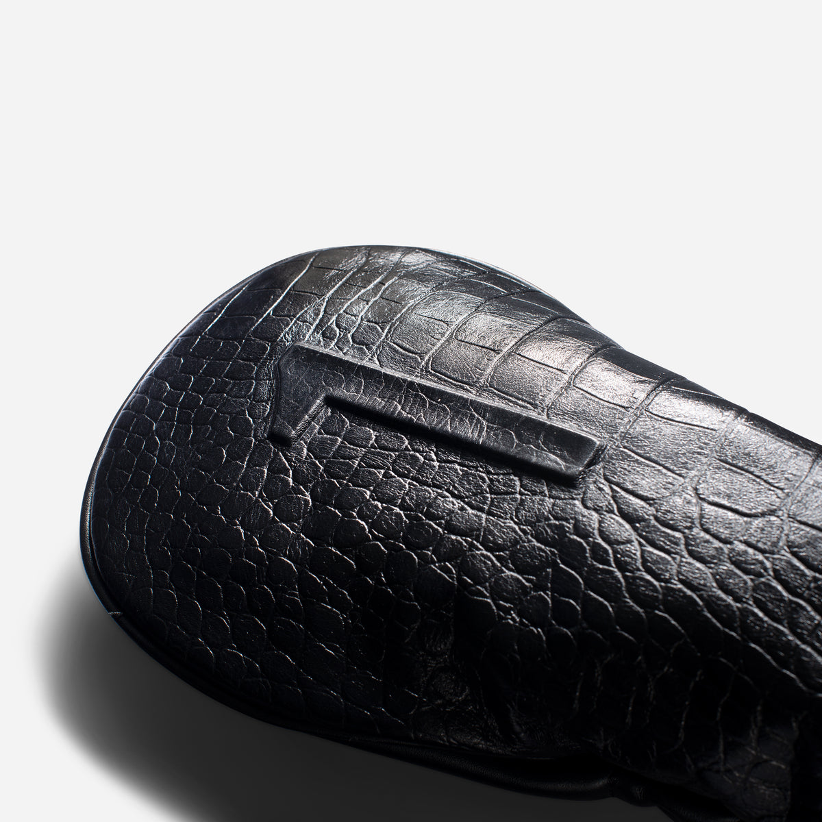 close up of embossed number on croc black leather headcover - driver #size_driver