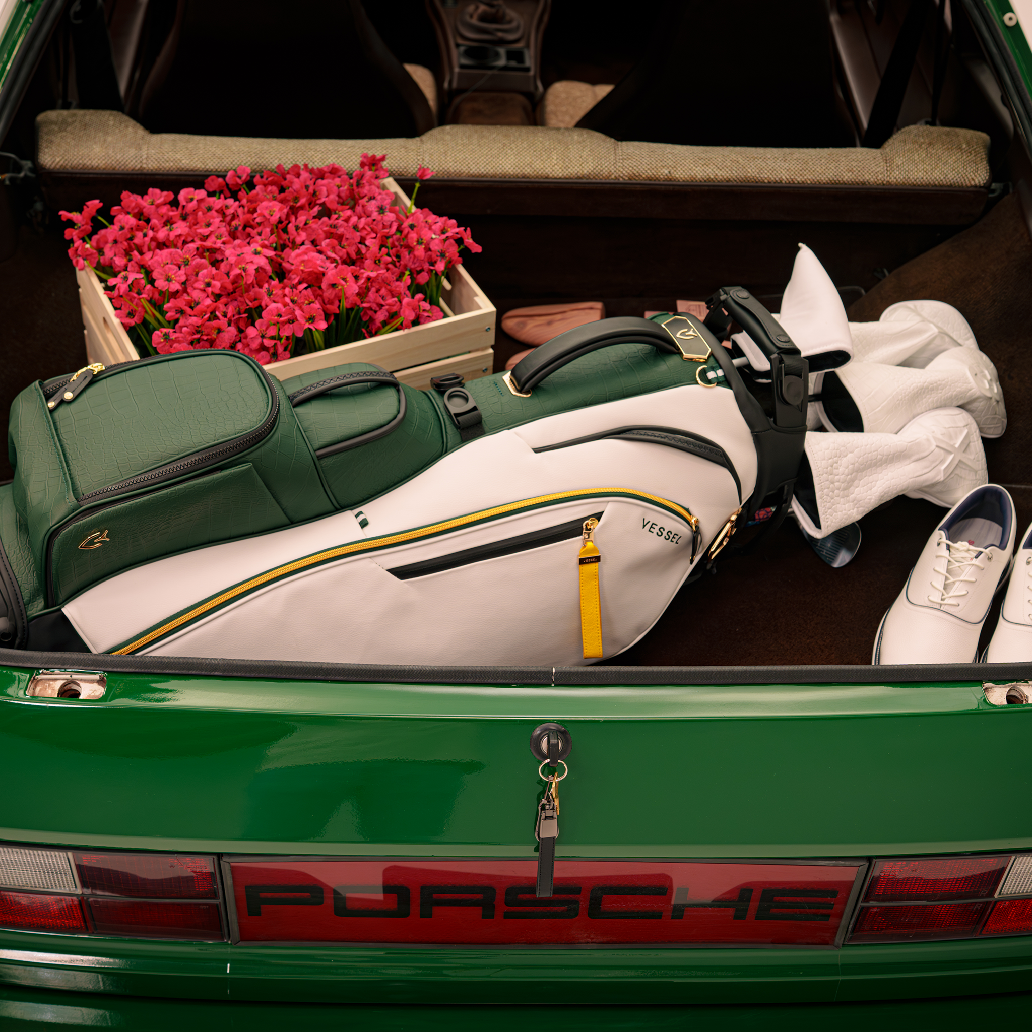 2026 Season Opener Player V Pro Stand in trunk of green porsche
