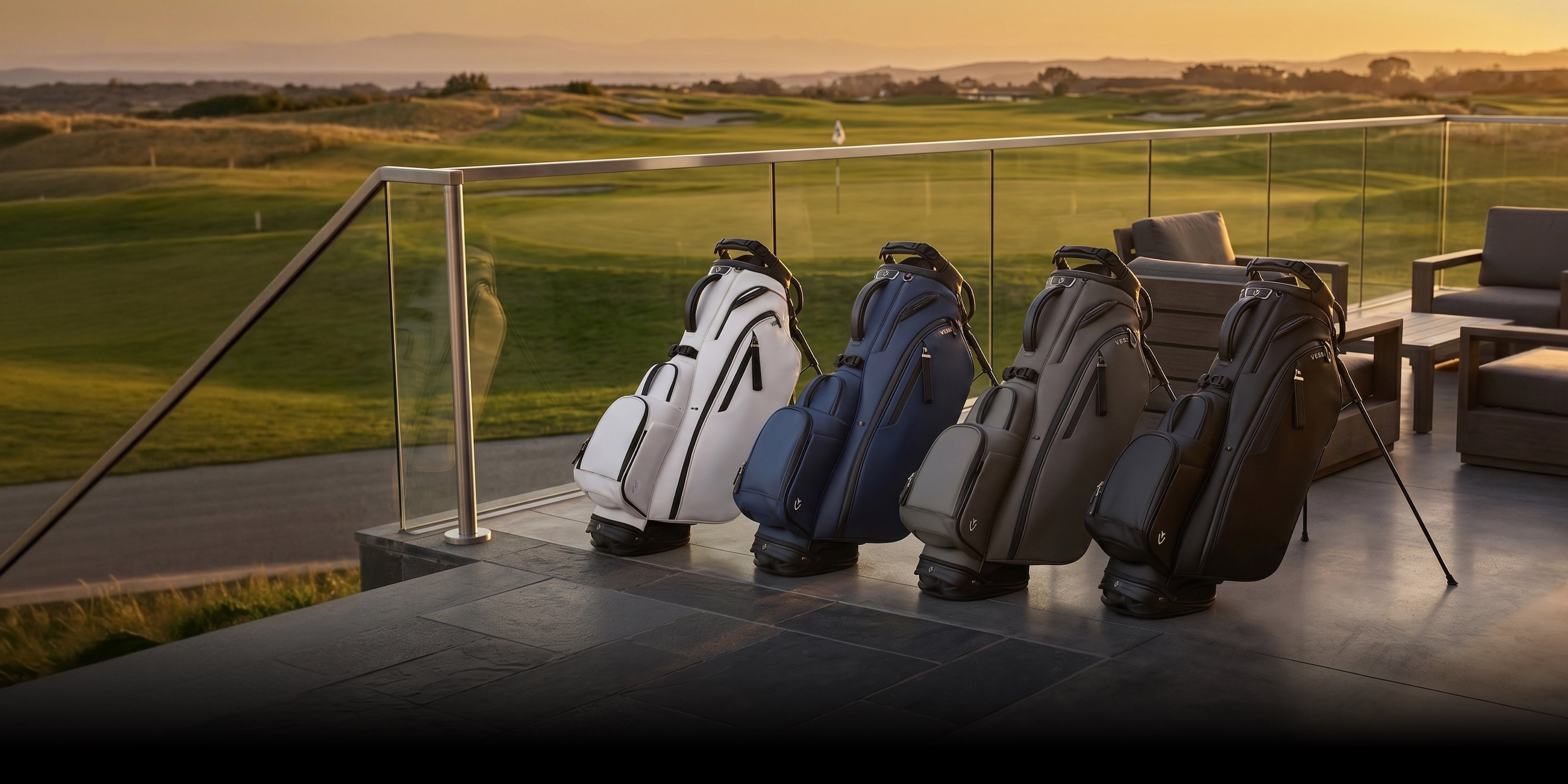 Four leather VESSEL golf bags on a fancy porch