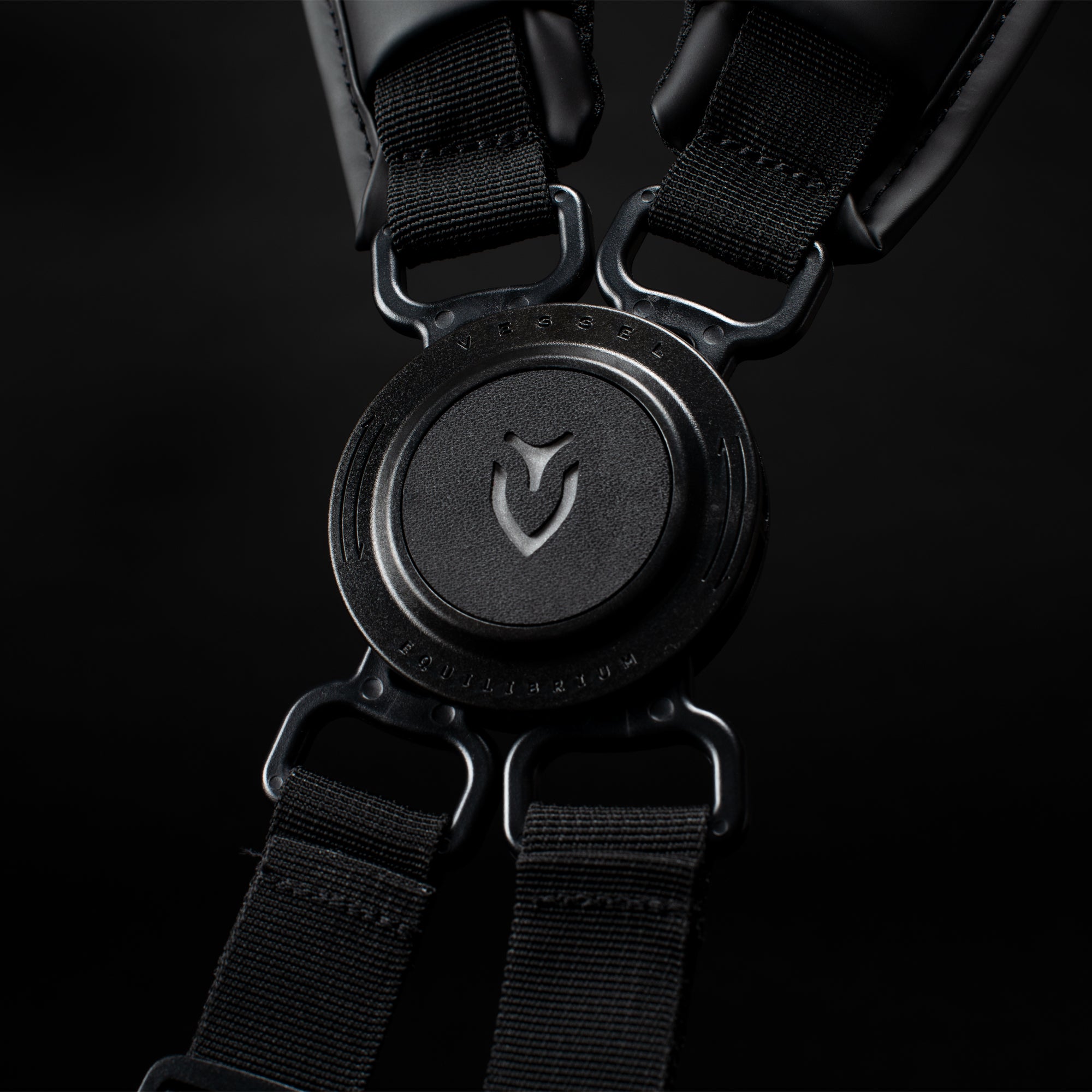 Close up image of black Equilibrium Strap in a black studio