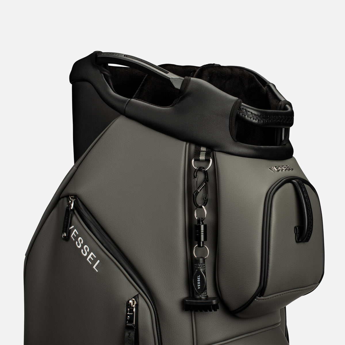 VESSEL x GrooveIt MiniG Brush on a carabiner on a VESSEL cart bag