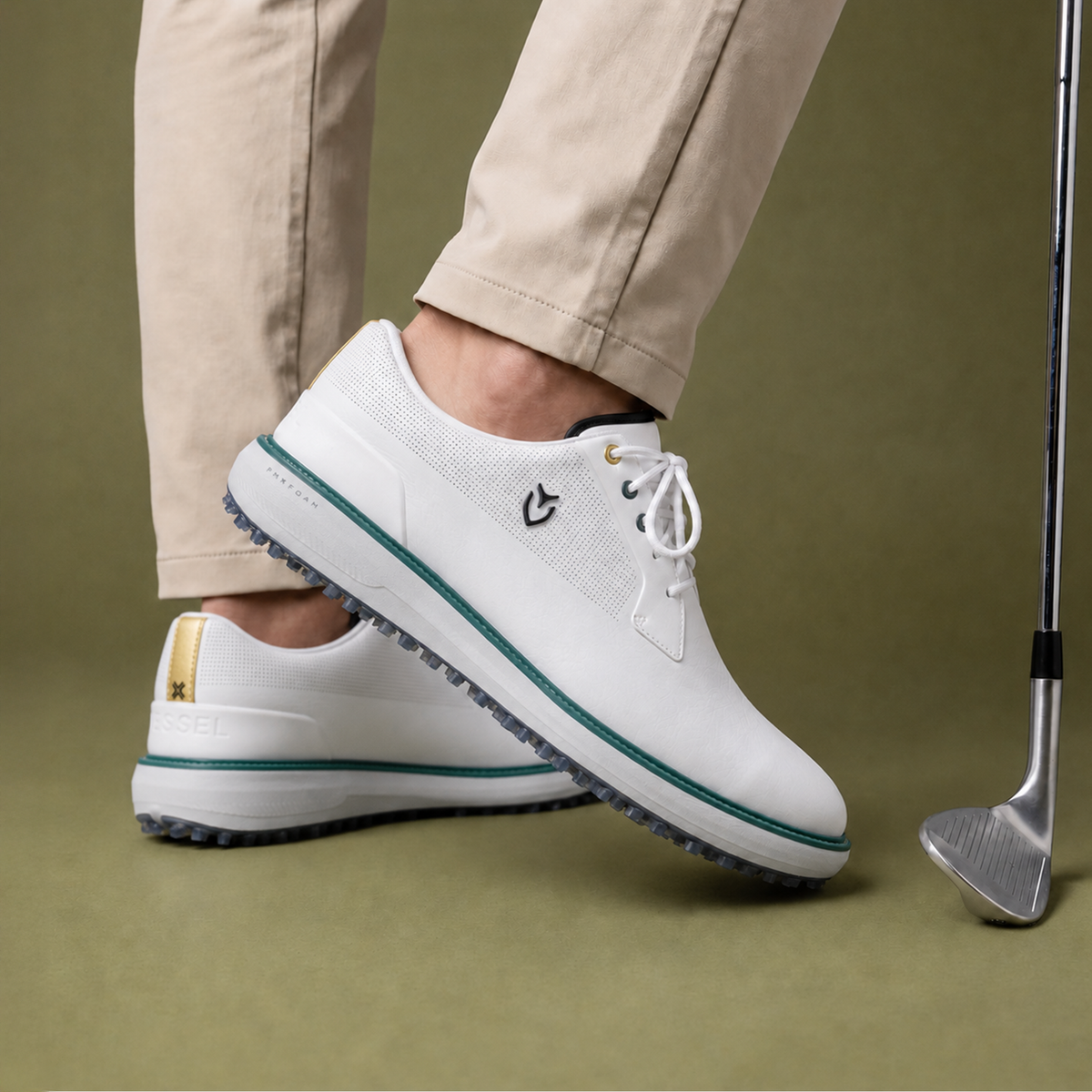 Person wearing VESSEL x Payntr SL Limited Edition Shoe with a golf iron