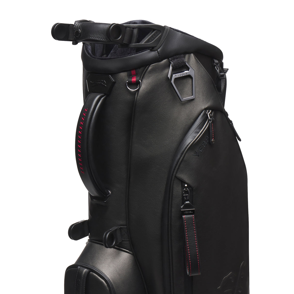 close up of Black leather golf bag with red accents on a white background