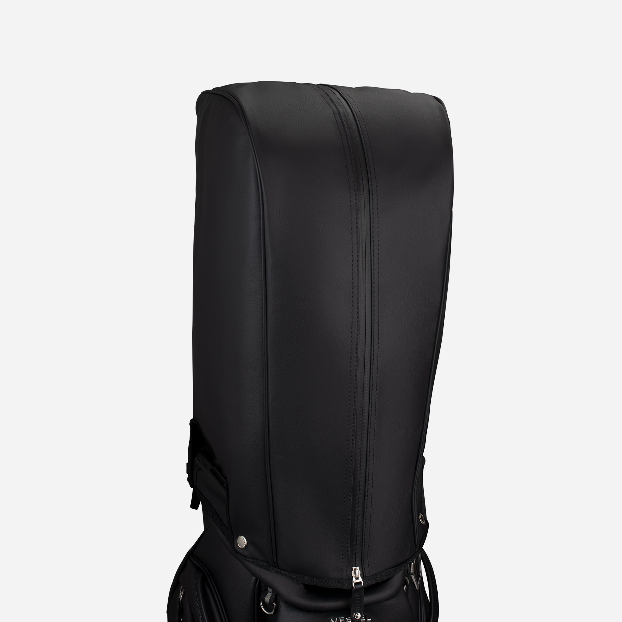 Black rain hood cover on top of black cart bag
