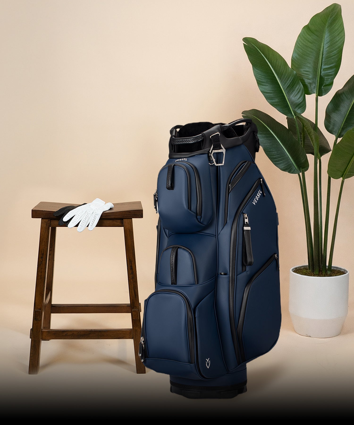Navy Lux Pro Cart II next to potted plant and wooden stool