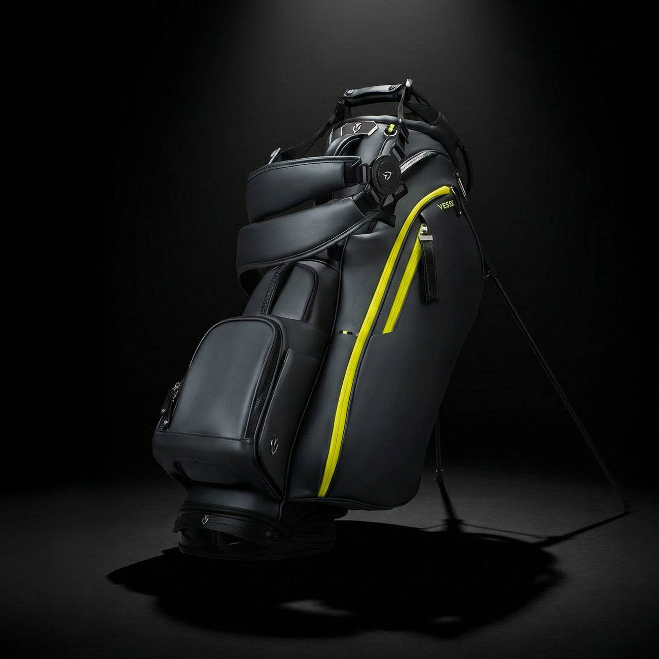 Black and neon yellow golf bag on a black background