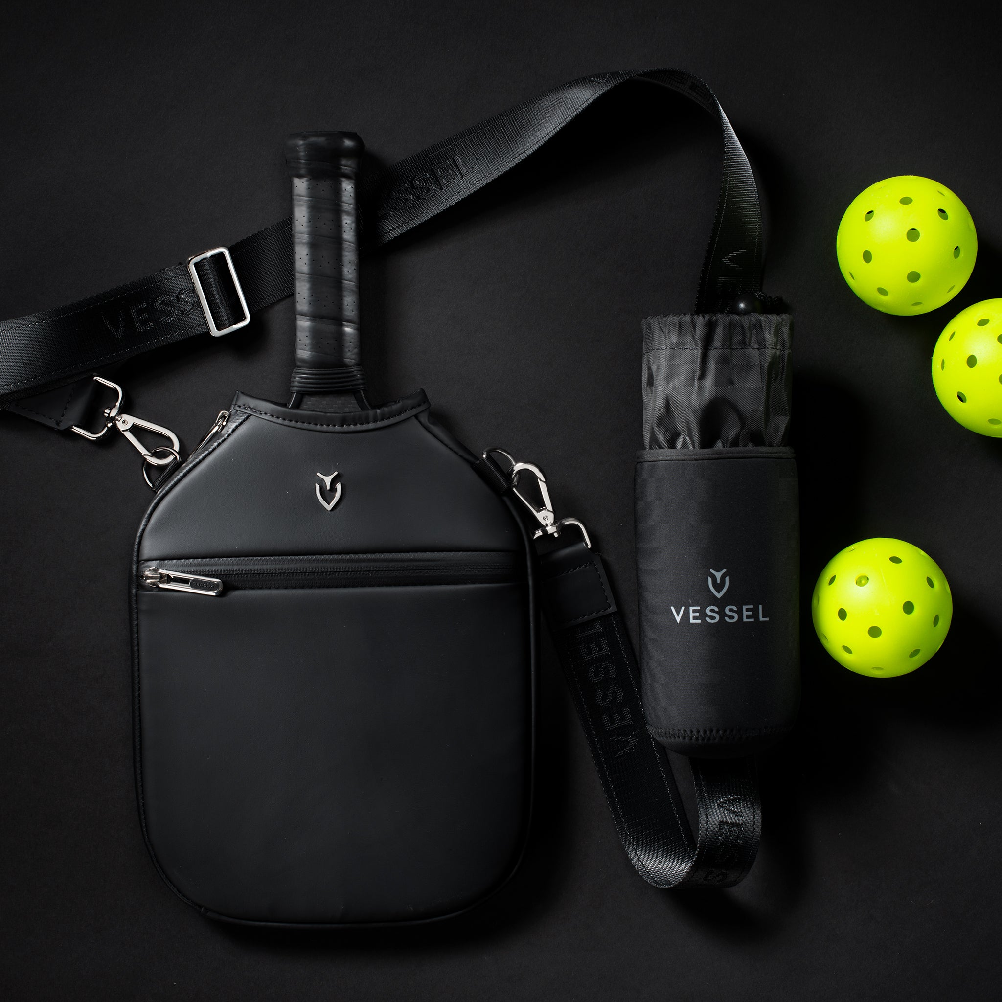 Pickleball Paddle Crossbody Cover and pickleball sleeve with pickleballs