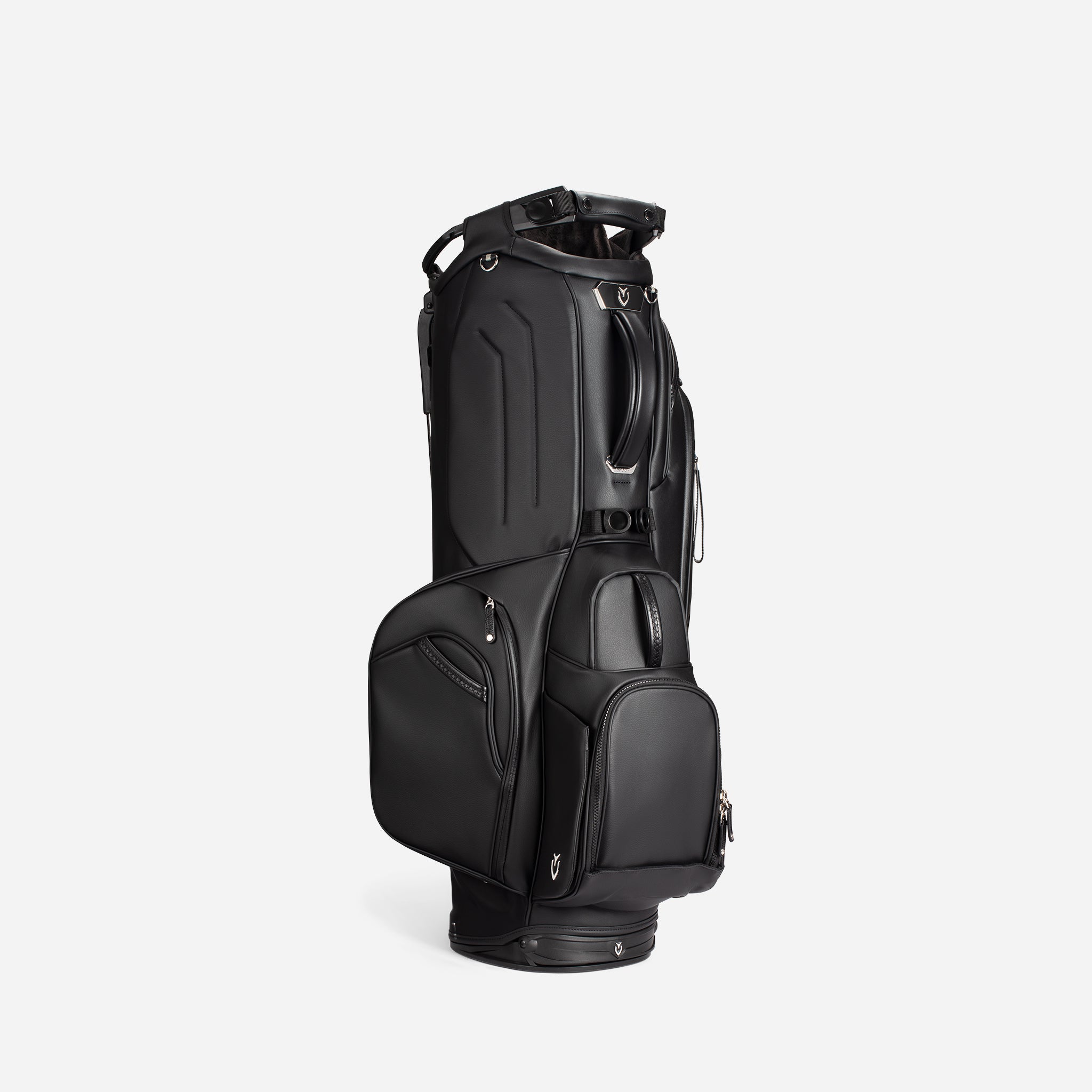 Black golf bag standing vertical on white background, turned to the right