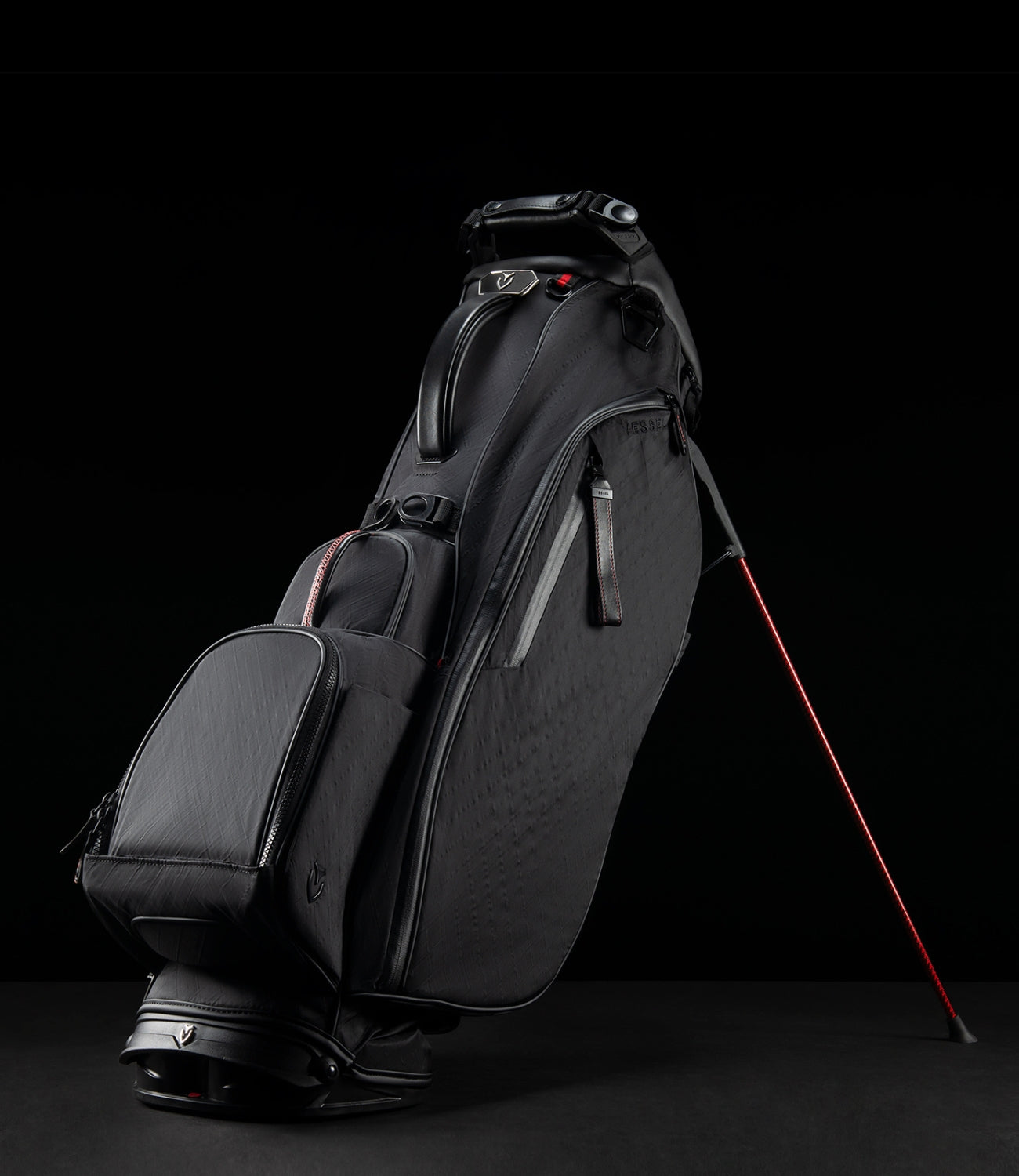 Black DXR Player V Stand Bag, with red accents on a black background.