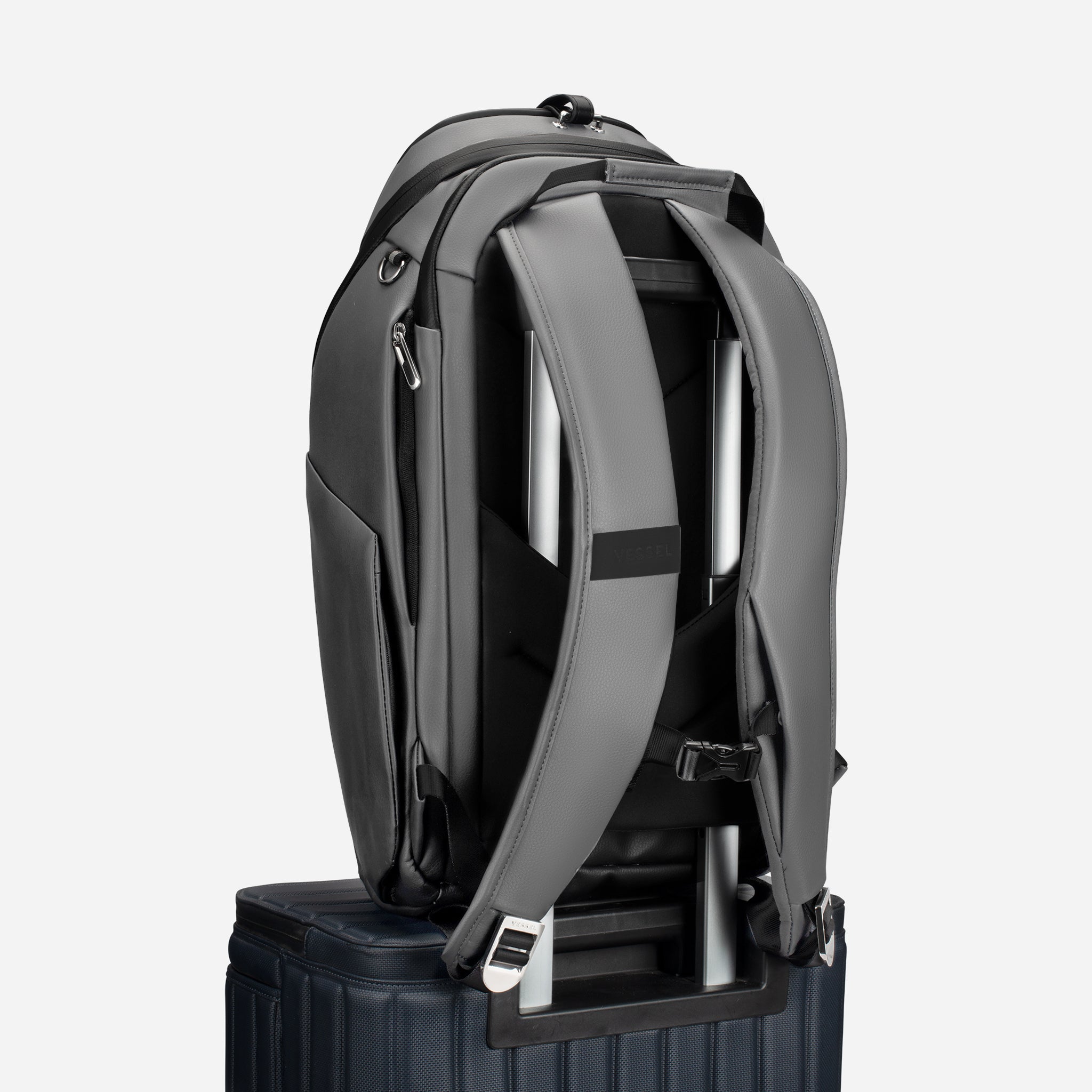 Grey PrimeX 2.0 Backpack on top of luggage