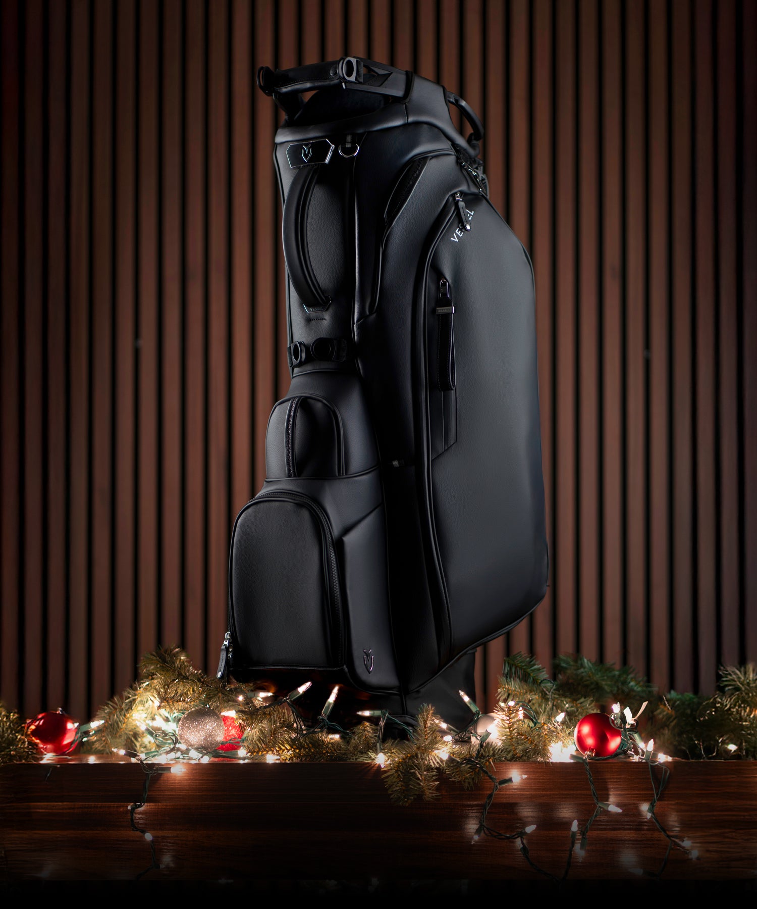 Black Player V Pro golf bag on top of Christmas lights