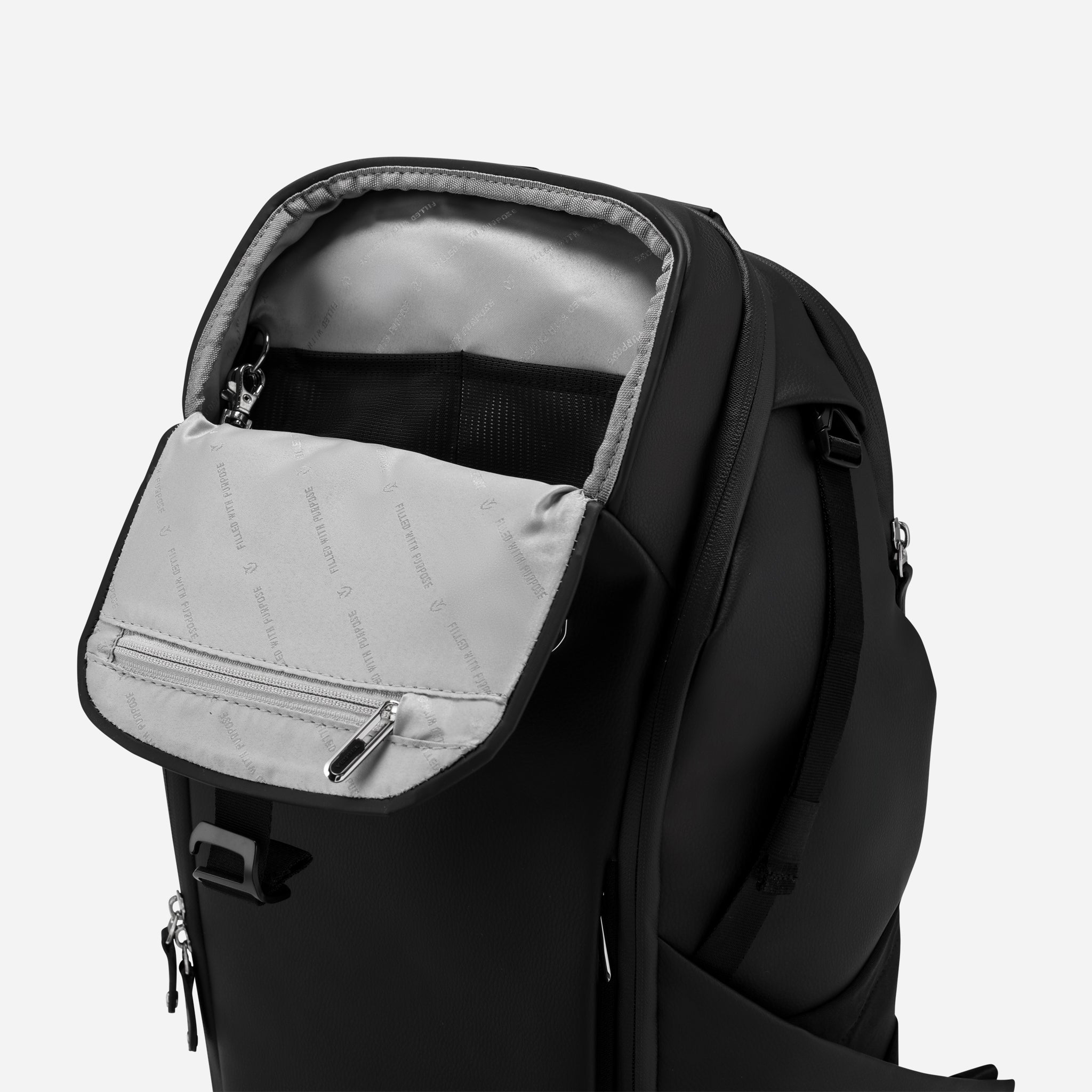 Upper magnetic pocket of Pebbled Black PrimeX Plus Backpack opened #color_pebbled black