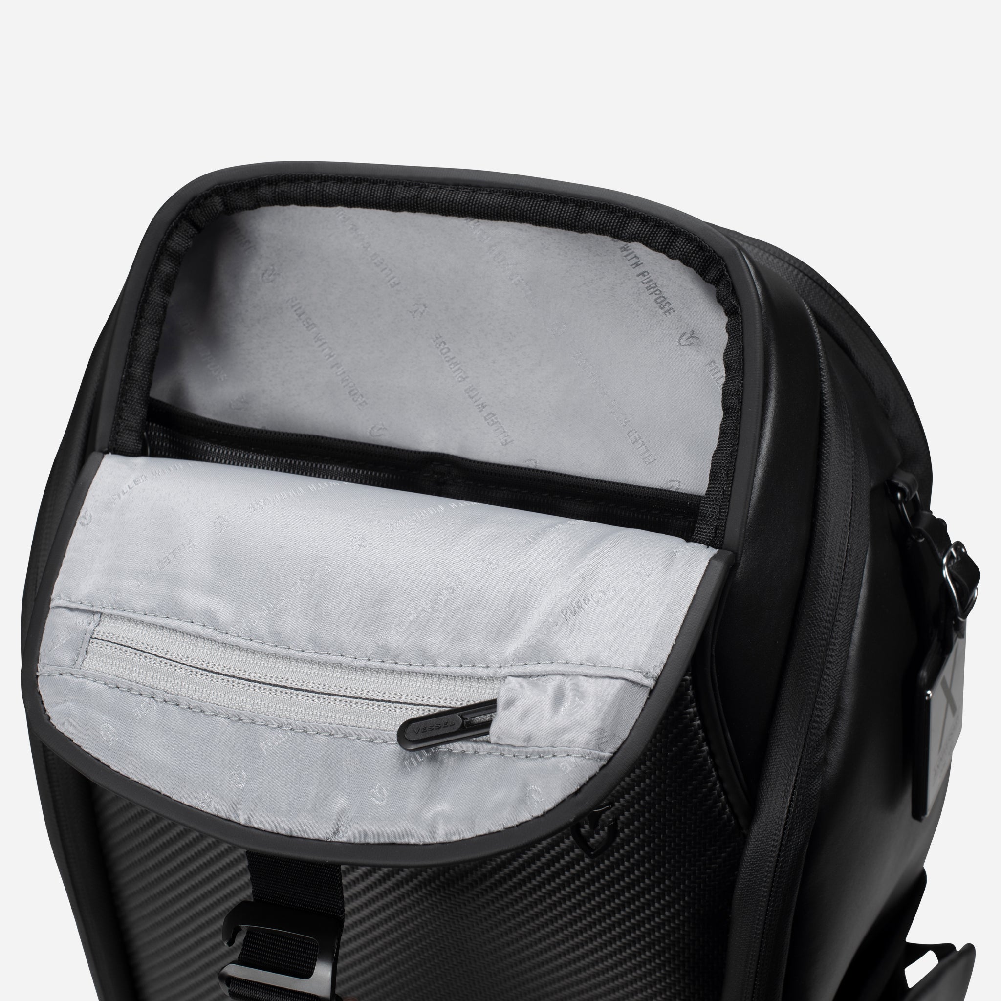 Upper magnetic pocket of PrimeX Carbon Black Backpack opened