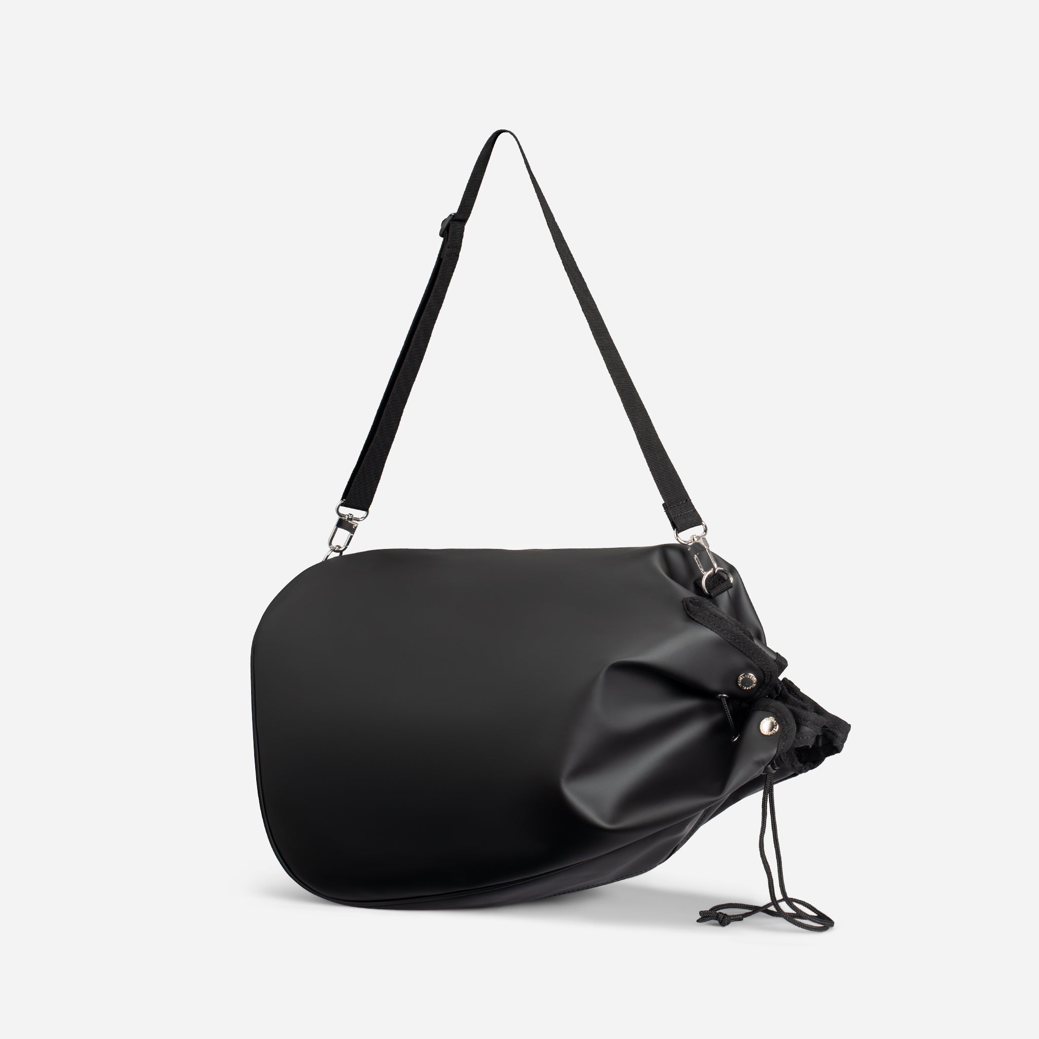 Black rain hood cover turned into a drawstring bag