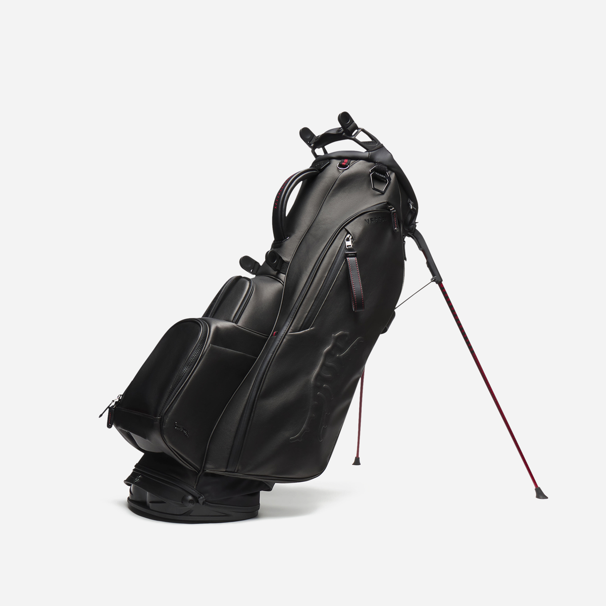 Black leather golf bag with red accents on a white background
