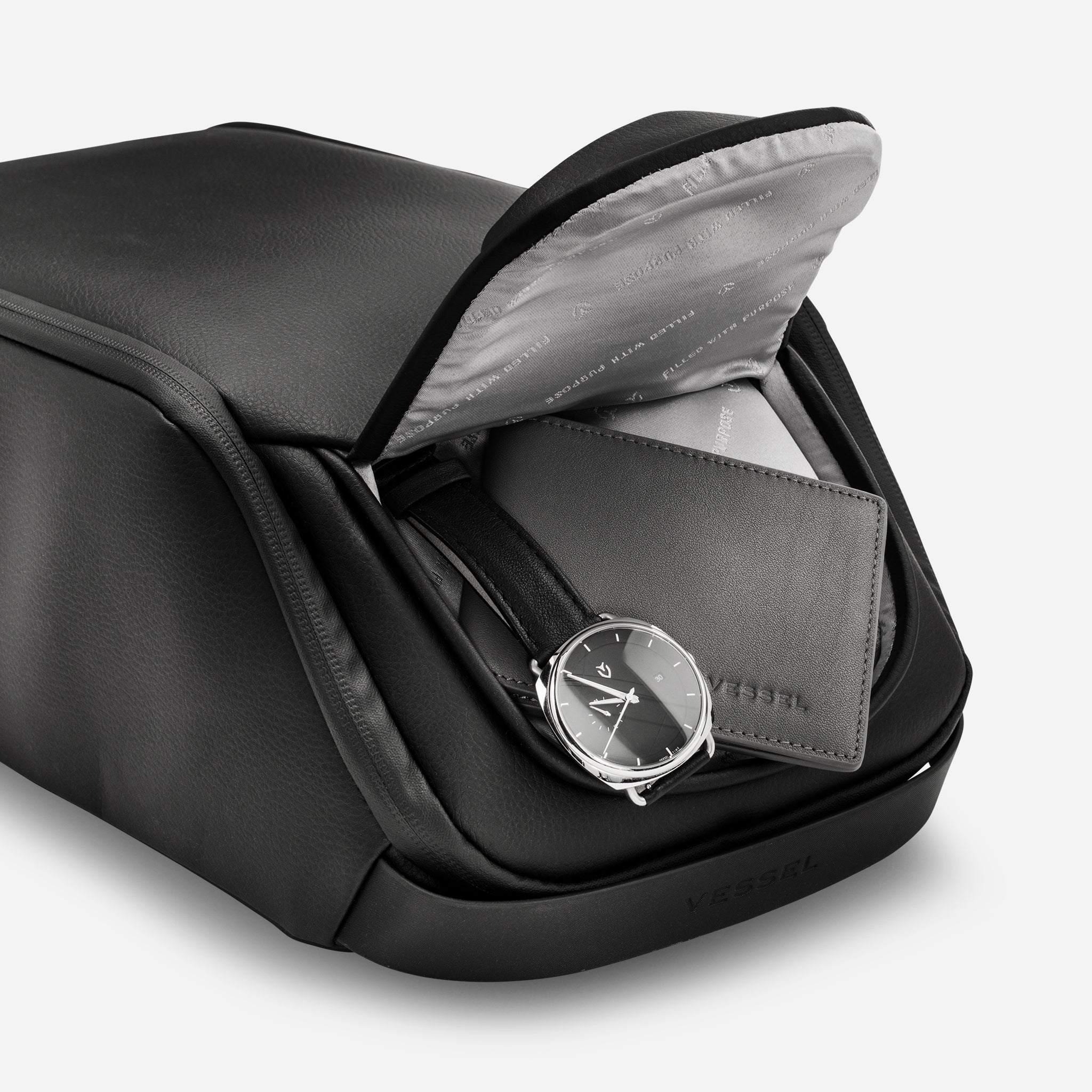 Inside of magnetic pocket in Pebbled Black Voyager Shoe Bag #color_pebbled black
