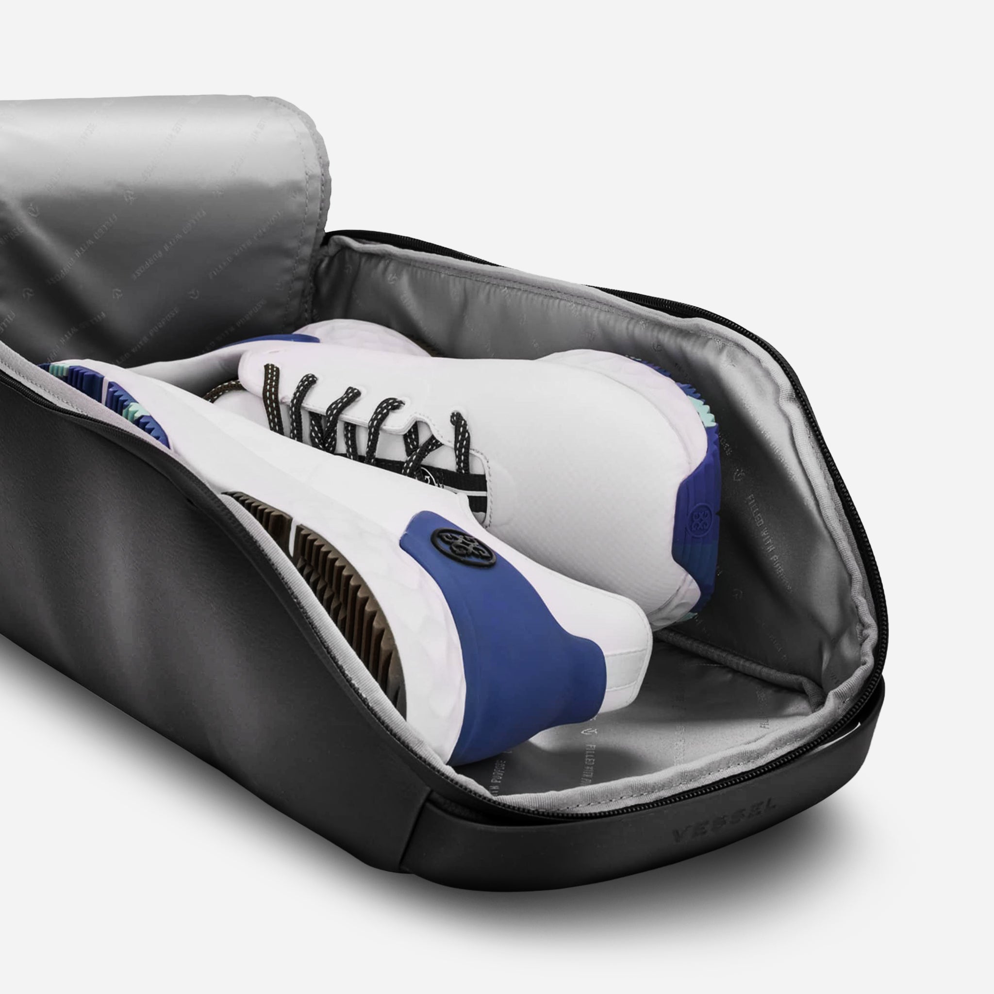 Pebbled Black Voyager Shoe Bag with shoes inside #color_pebbled black