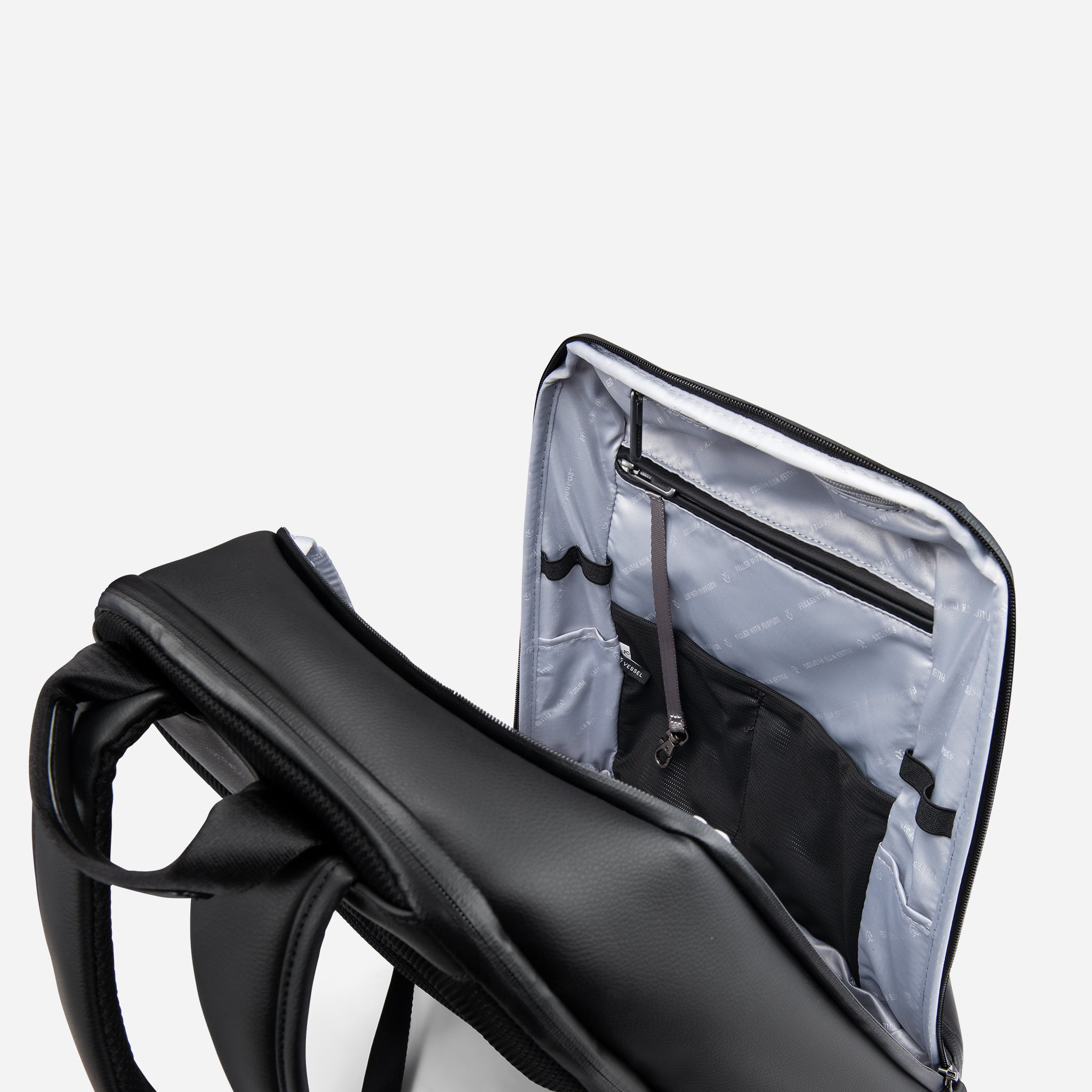 Inside the main compartment of Pebbled Black Signature Backpack #color_pebbled black