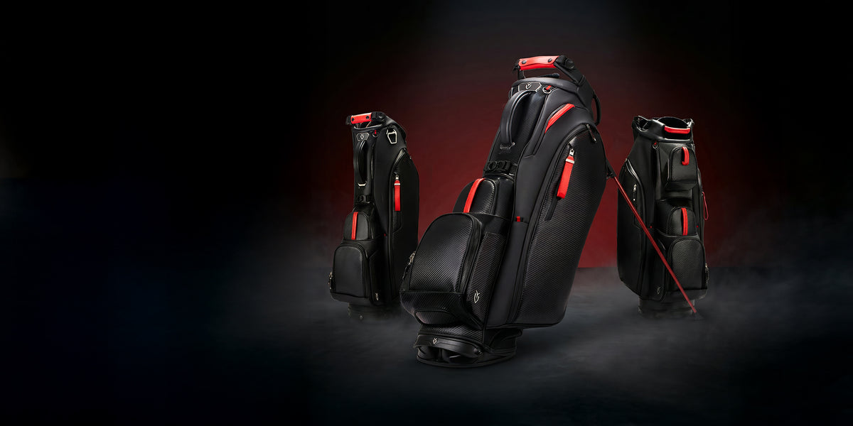 Three black golf bags with red accents against a dark red background