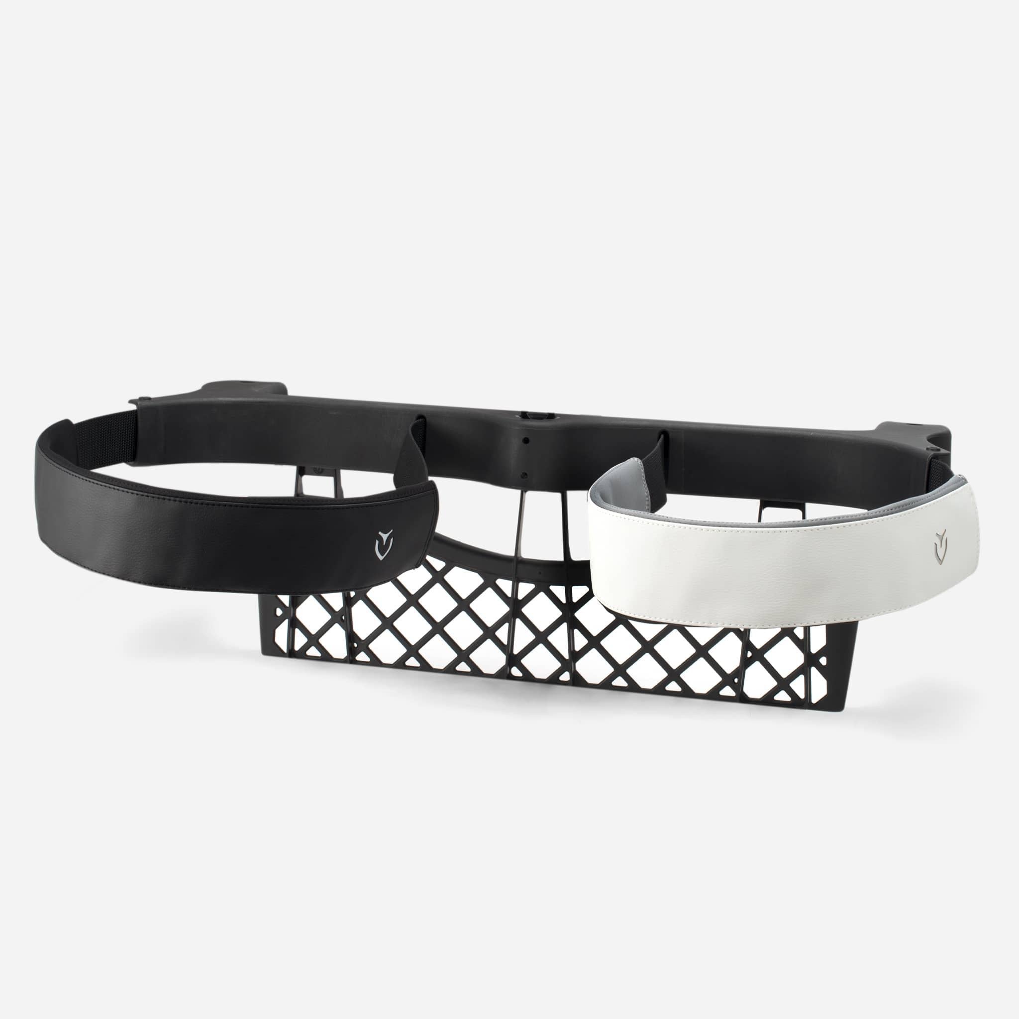 Two cart strap sleeves, one black, one white, being shown in use #color_pebbled black