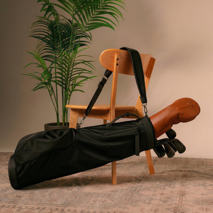 The sunday carry bag hanging on the back of a chair