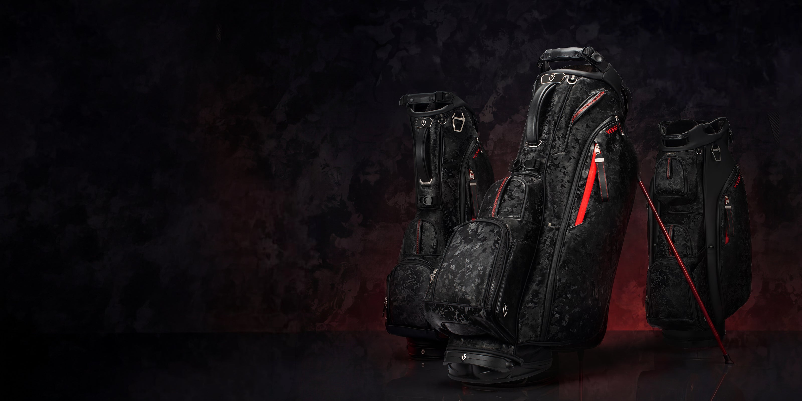 Three camo black leather golf bags against a gradient background