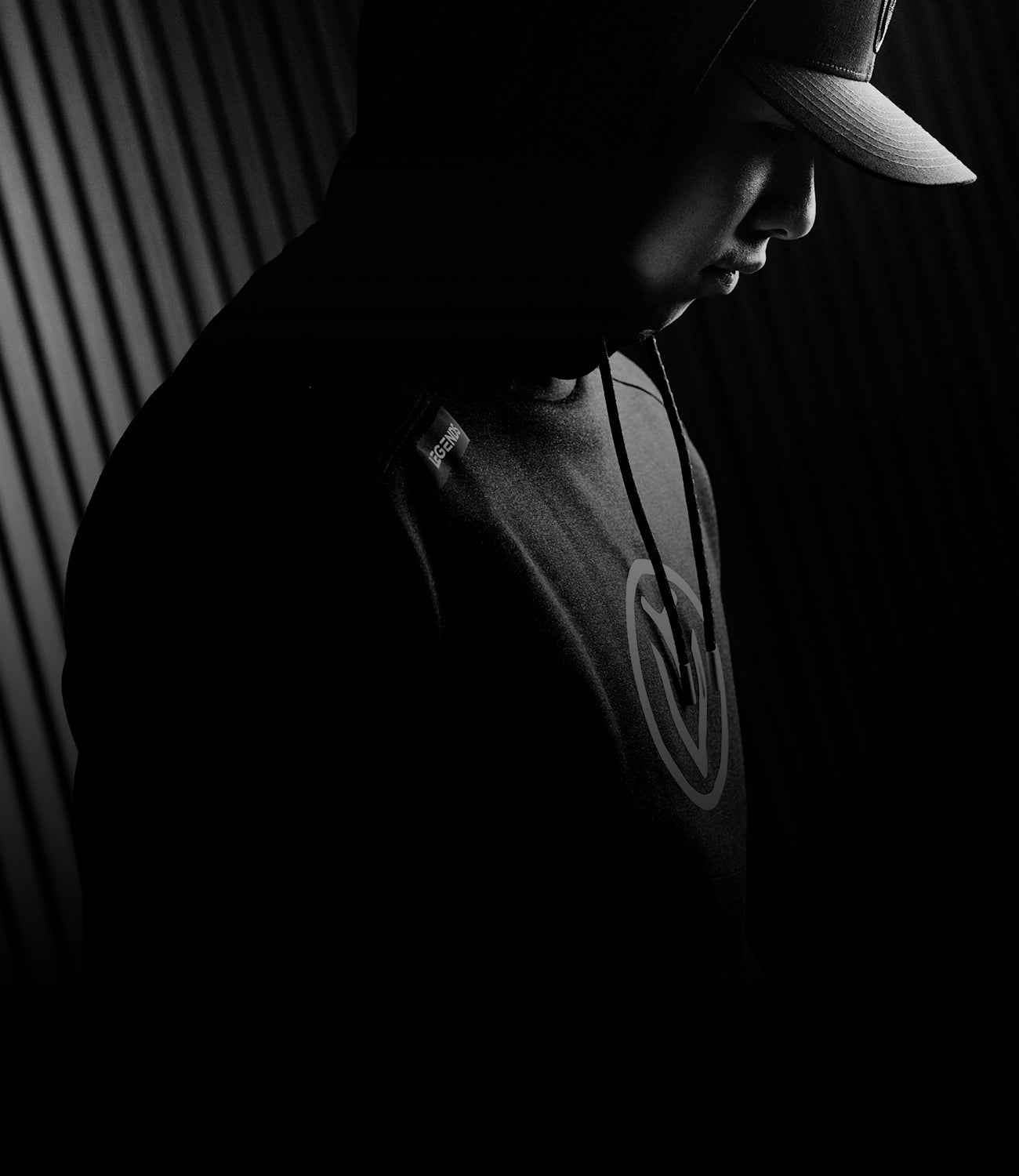 black and white photo of man wearing vessel hoodie