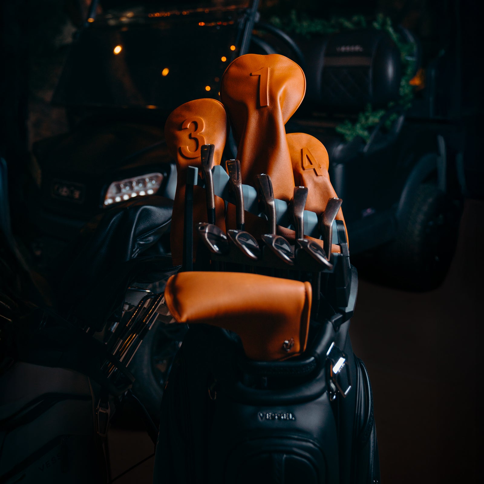 Brown leather golf headcovers in golf bag, Christmas background