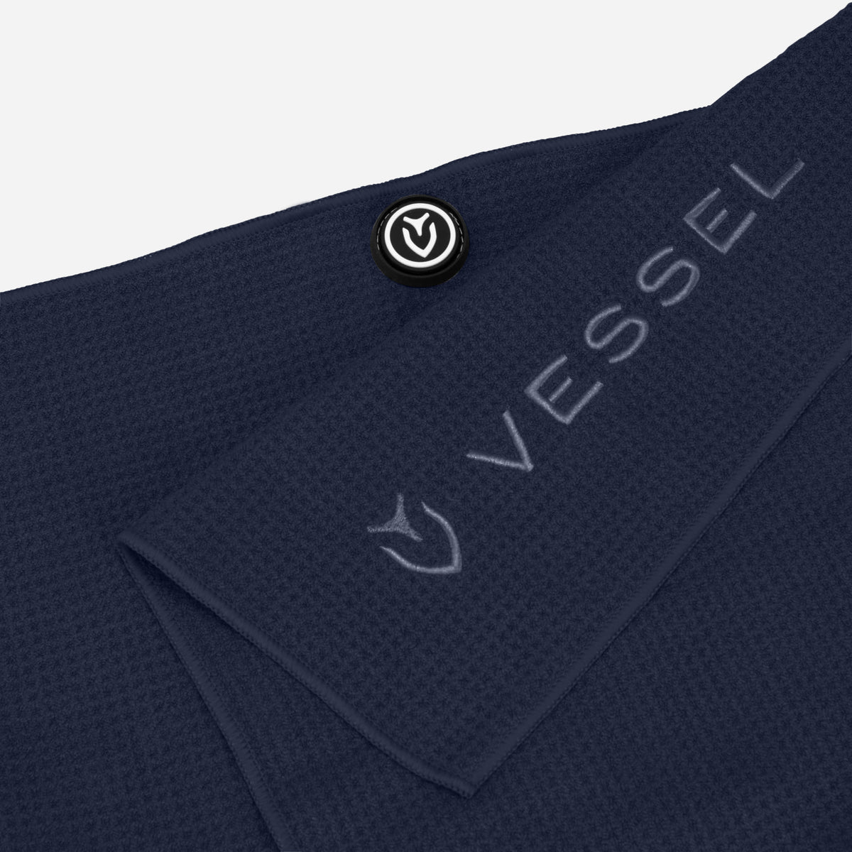 Close up of embroidered logo on navy Magnetic Golf Towel | 20" x 40" #color_navy
