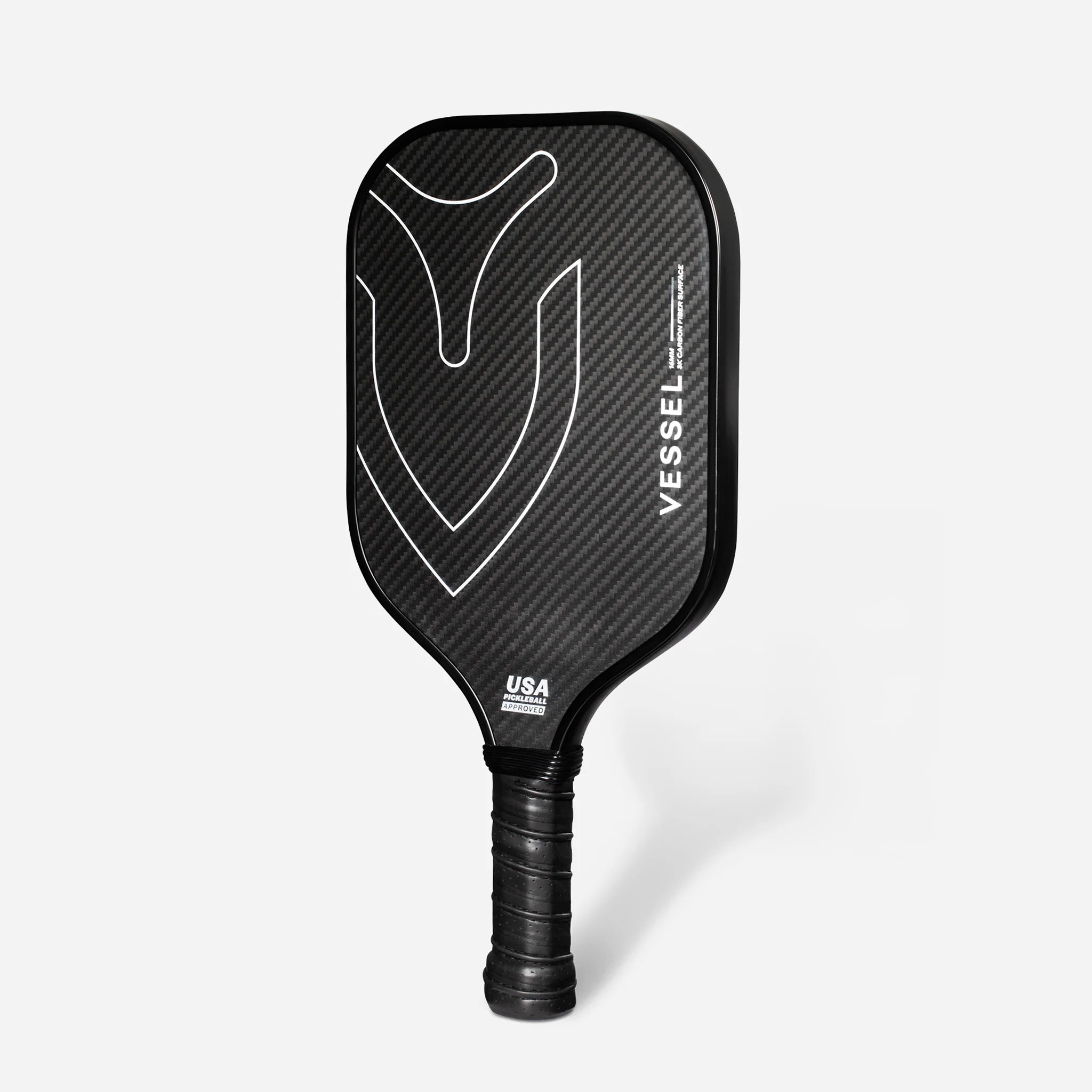 Black carbon fiber pickleball paddle with Vessel branding on the face turned to the left