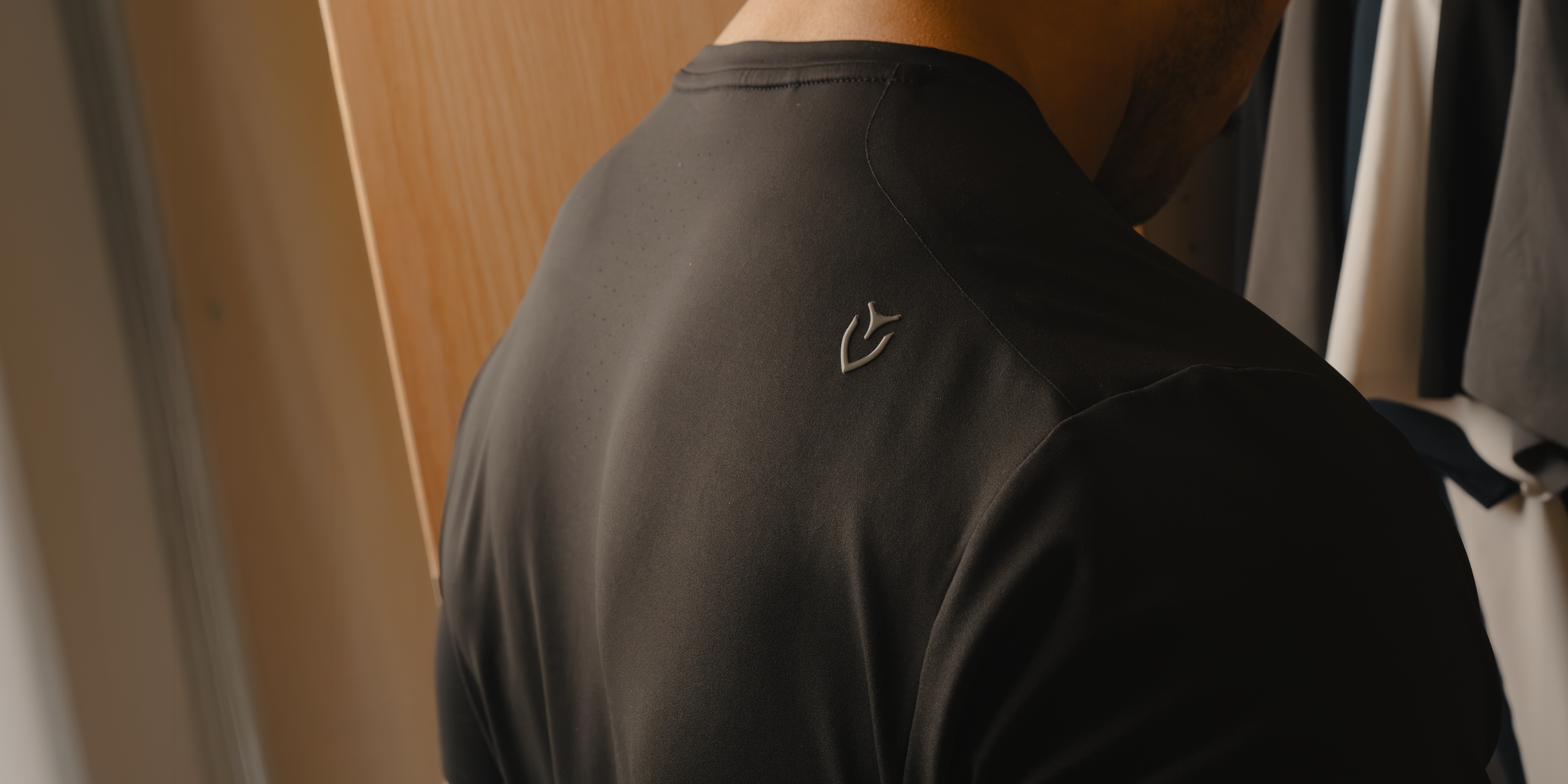 Back of Black Performance Tech Tee