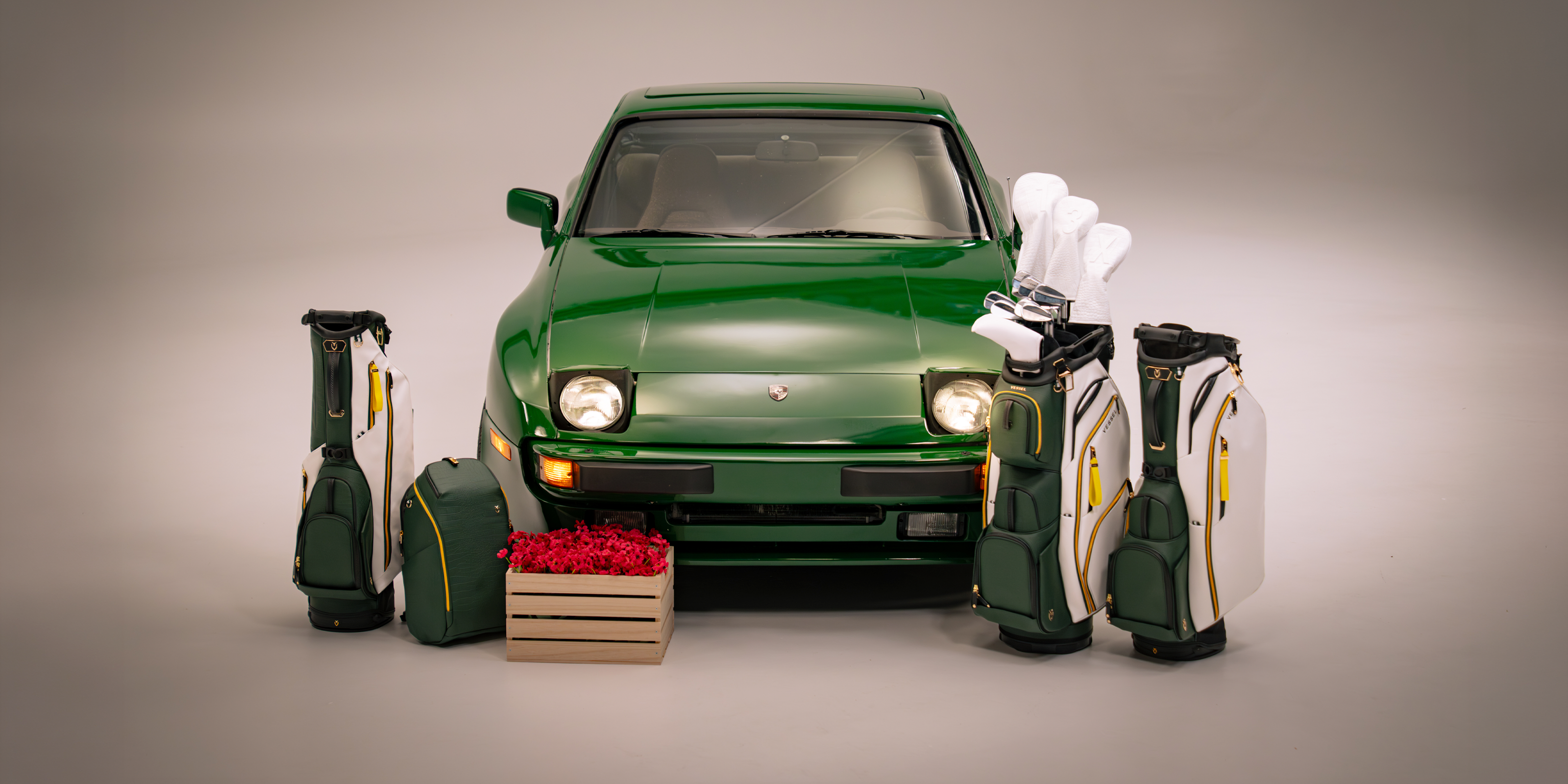 Season opener collection bags around a green porsche