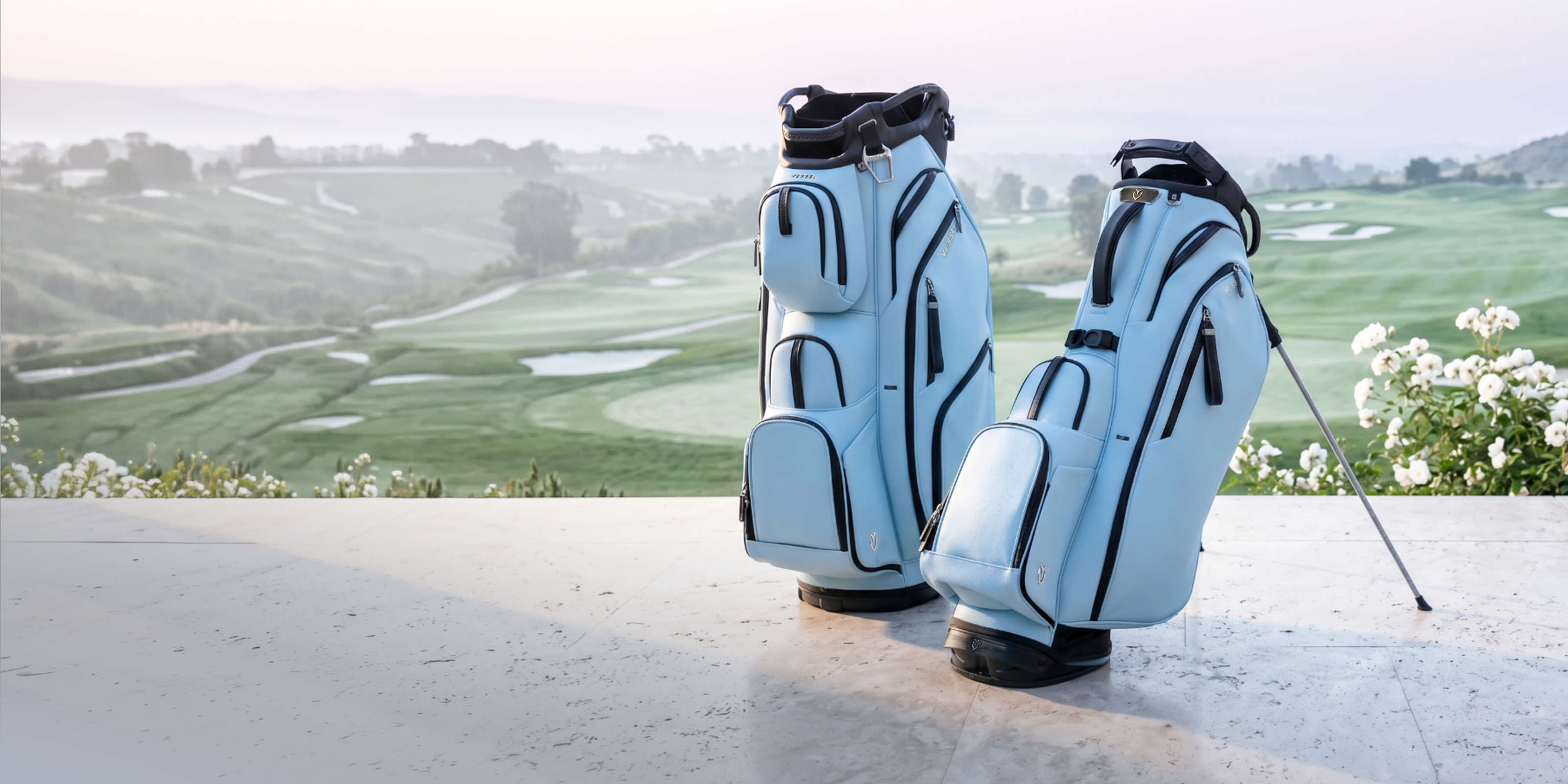 Sky colored leather golf bags against a golf course