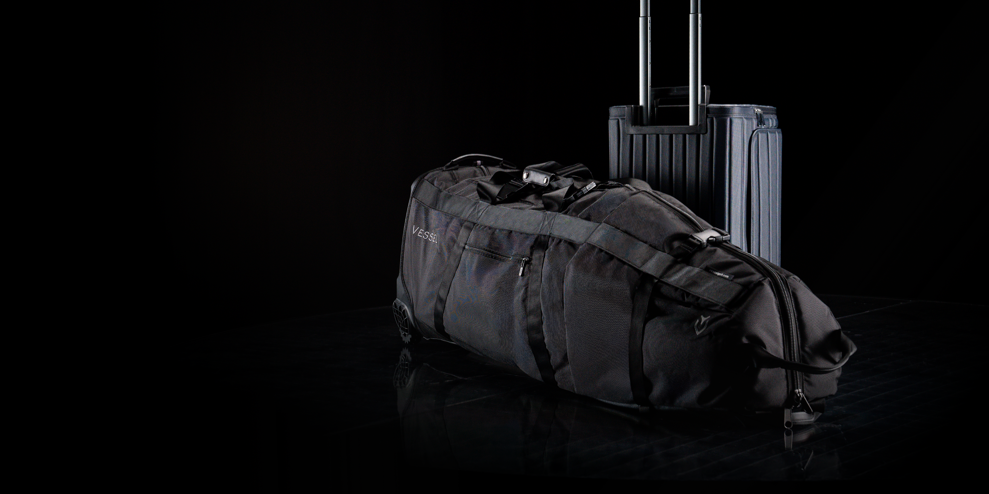Golf travel bag and suitcase against a black background