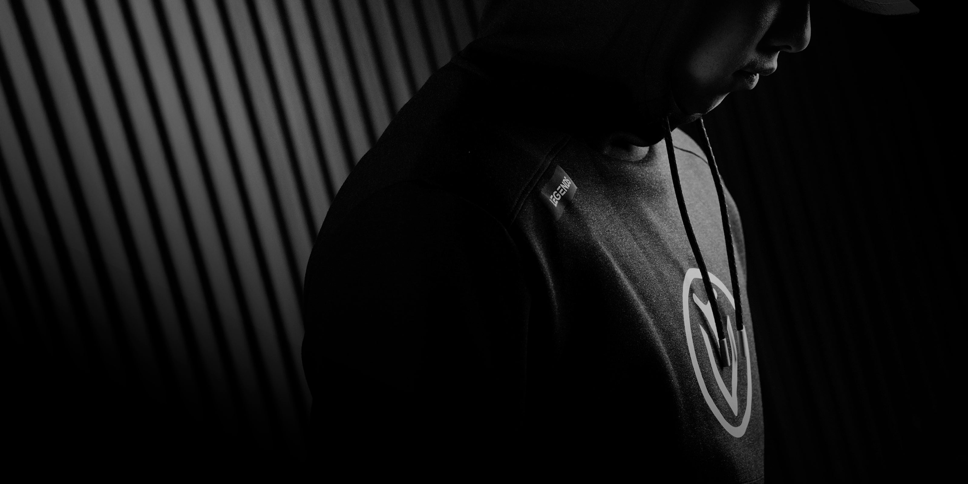 black and white photo of man wearing vessel hoodie