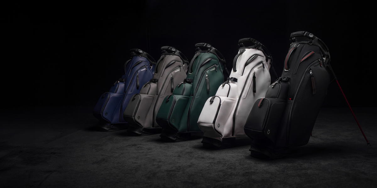 five Player VI Pro golf bags lined up against a dark grey background
