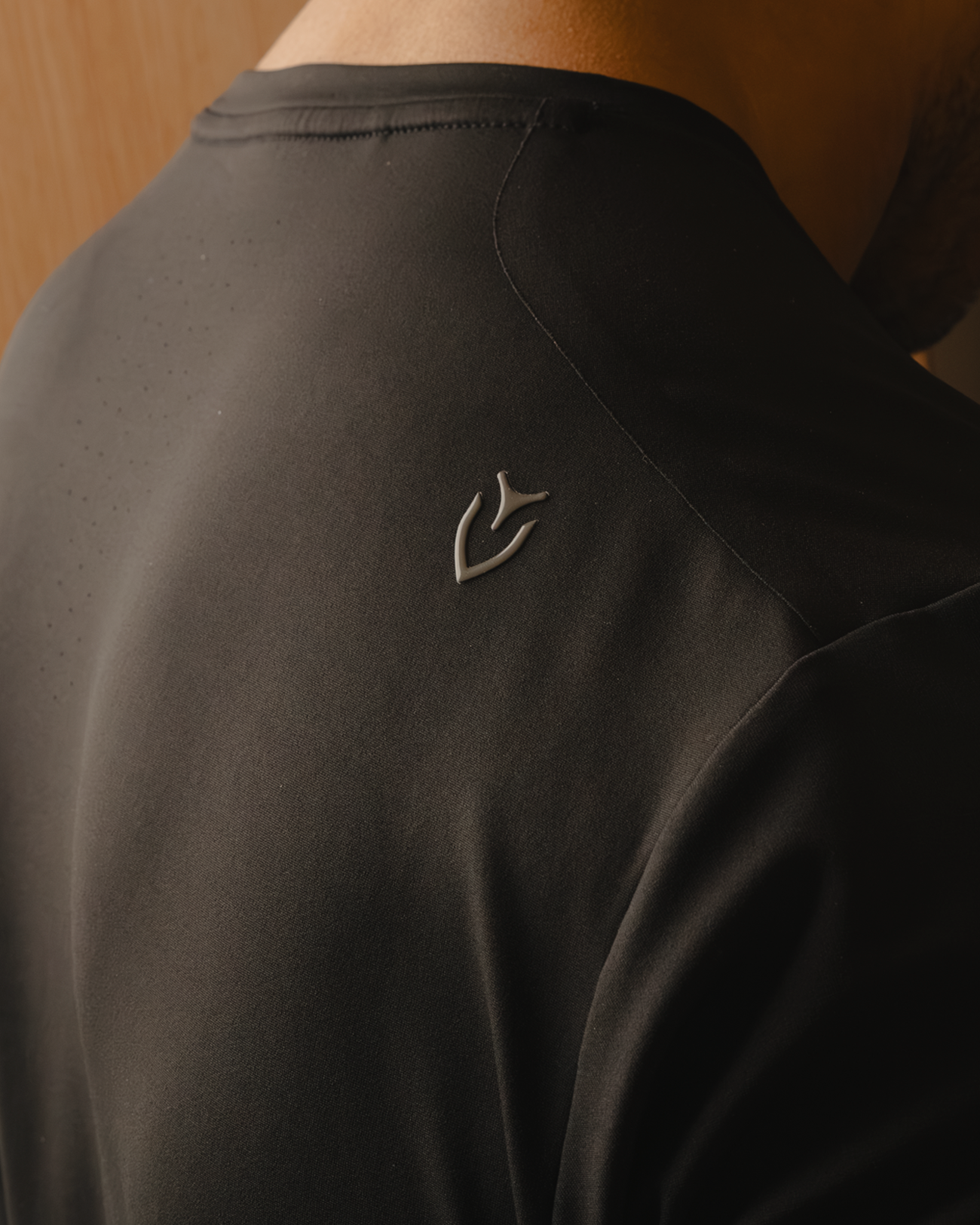 Back of Black Performance Tech Tee on model