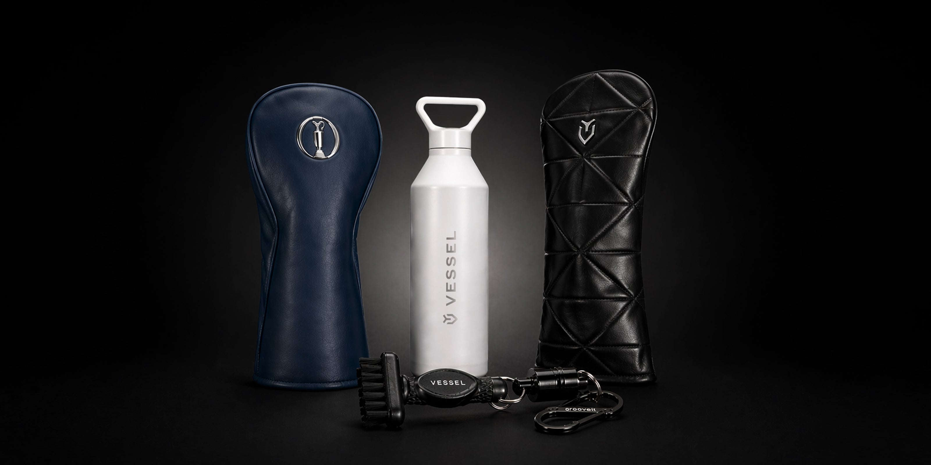 Collection of golf accessories on a black gradient background