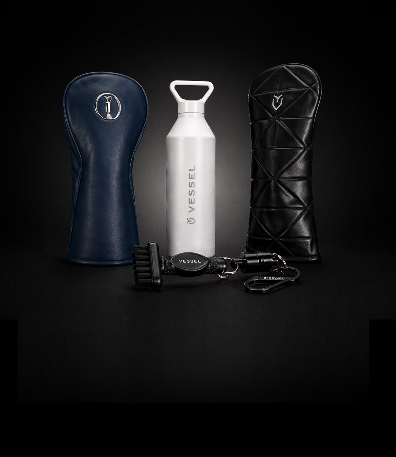 Collection of golf accessories on a black gradient background