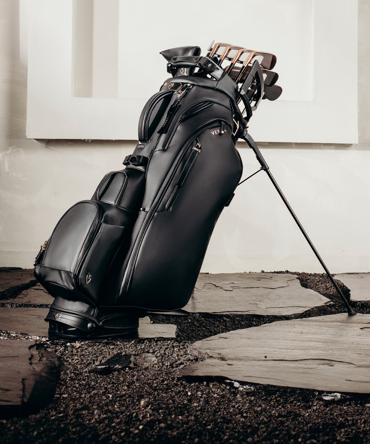 A black golf stand bag with a golf club organizer.