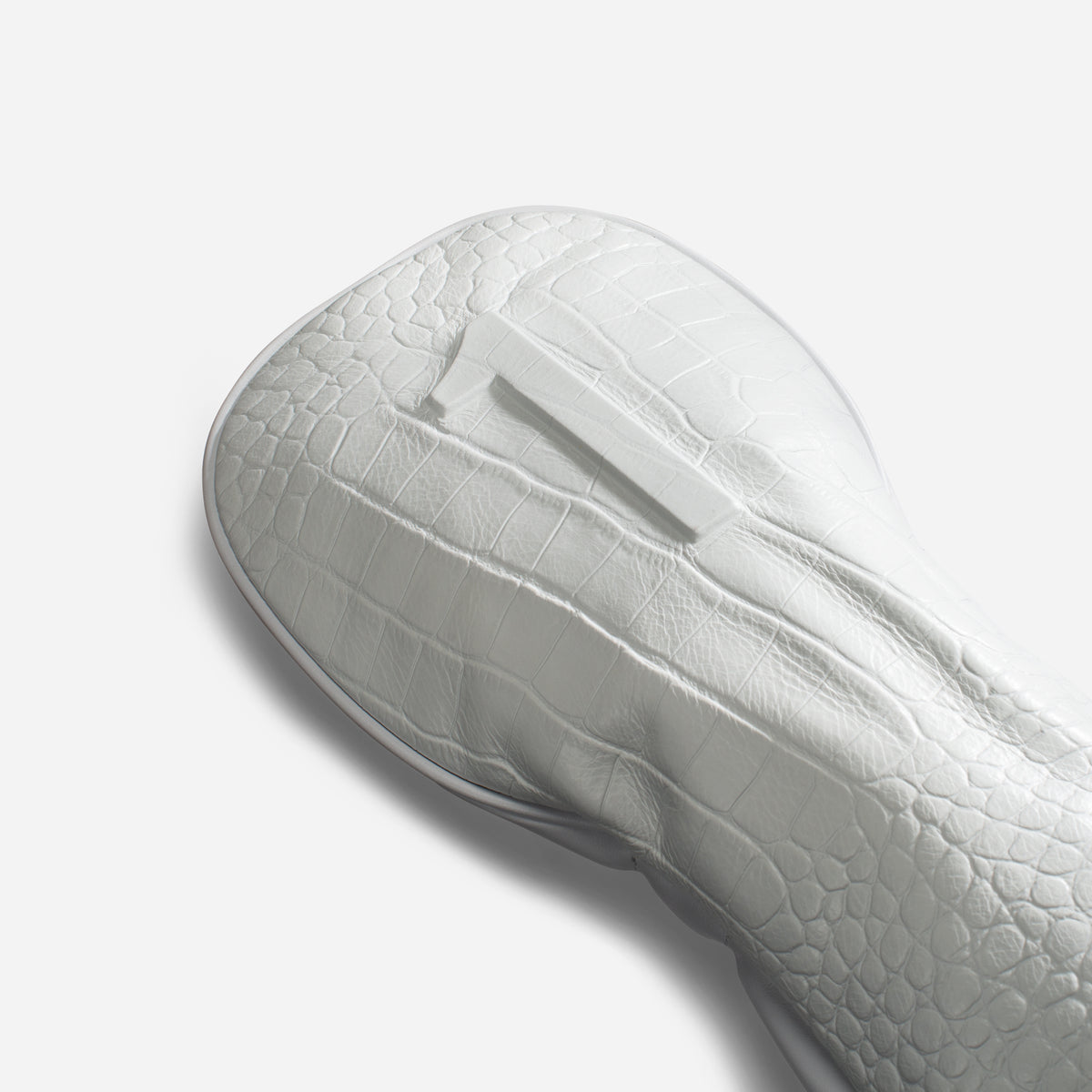 close up of embossed number on croc white leather headcover - driver #size_driver