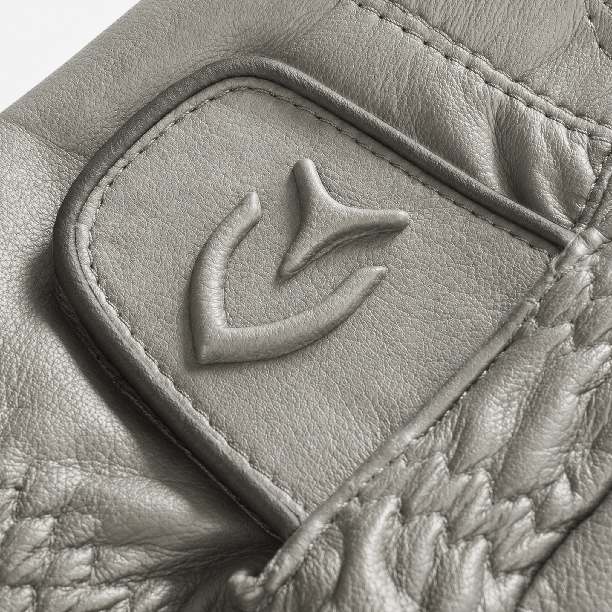 Close up of embossed logo on velcro strap of Left handed grey VESSEL Lux Golf Glove #hand_left