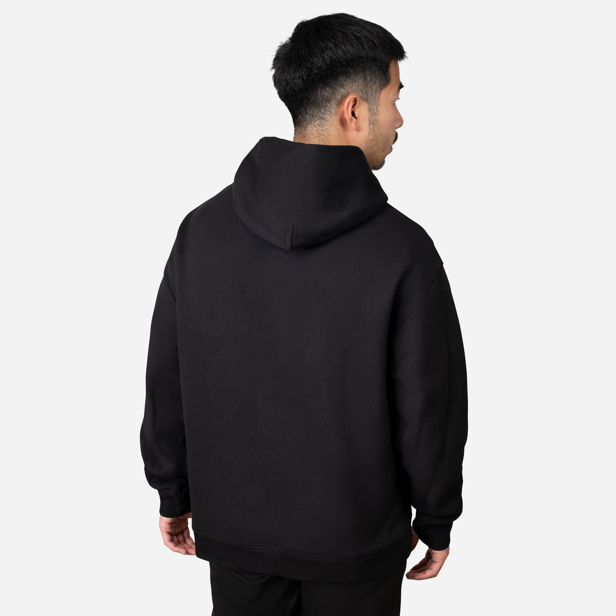 Backside of man wearing black  VESSEL Hoodie #color_black