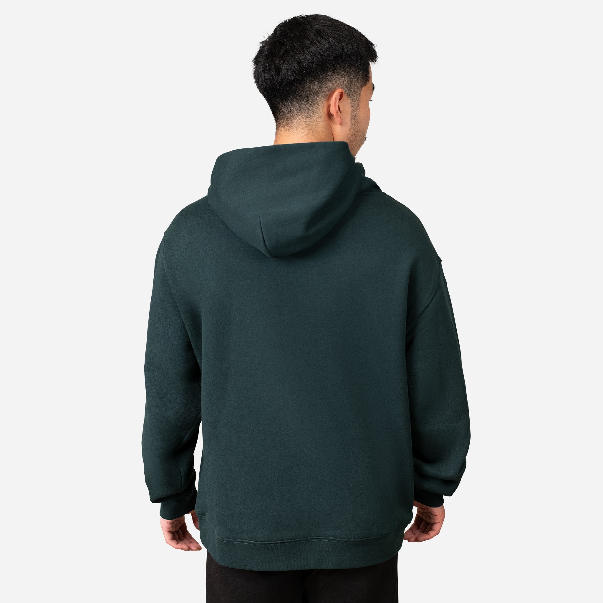 Back of man wearing green VESSEL Hoodie #color_green